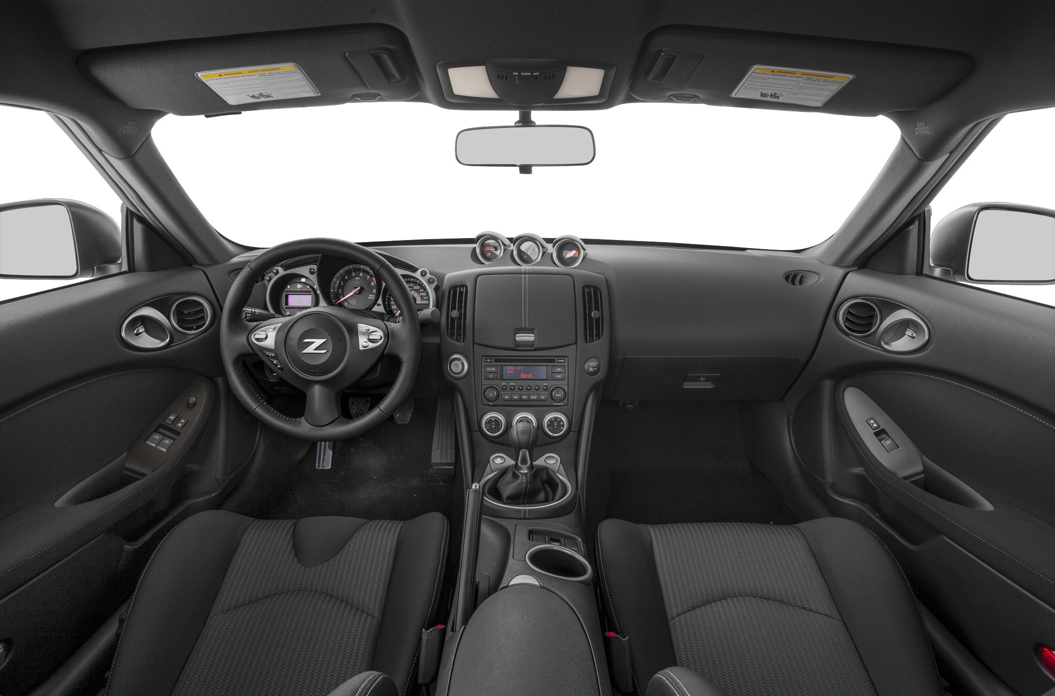 Dashboard and steering wheel view with center console and manual gear shift