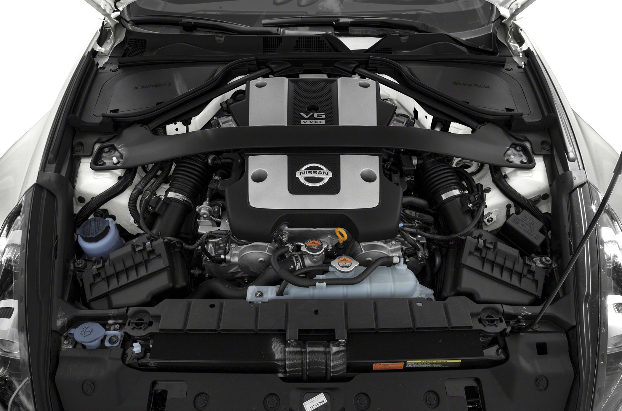 V6 engine bay with Nissan branded engine cover and visible components