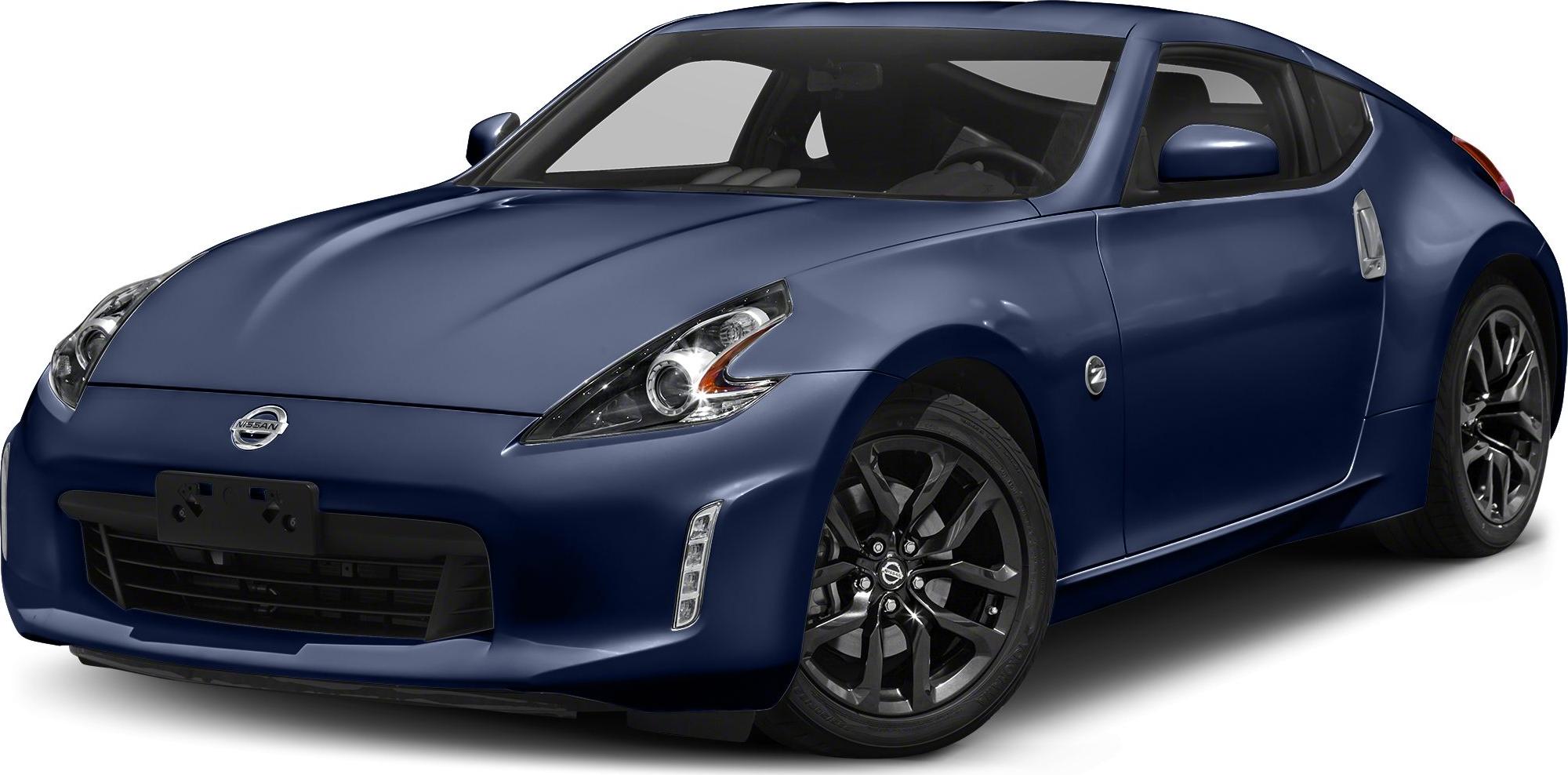 Sharp headlights and bold, dark alloy wheels on a sleek sporty coupe.