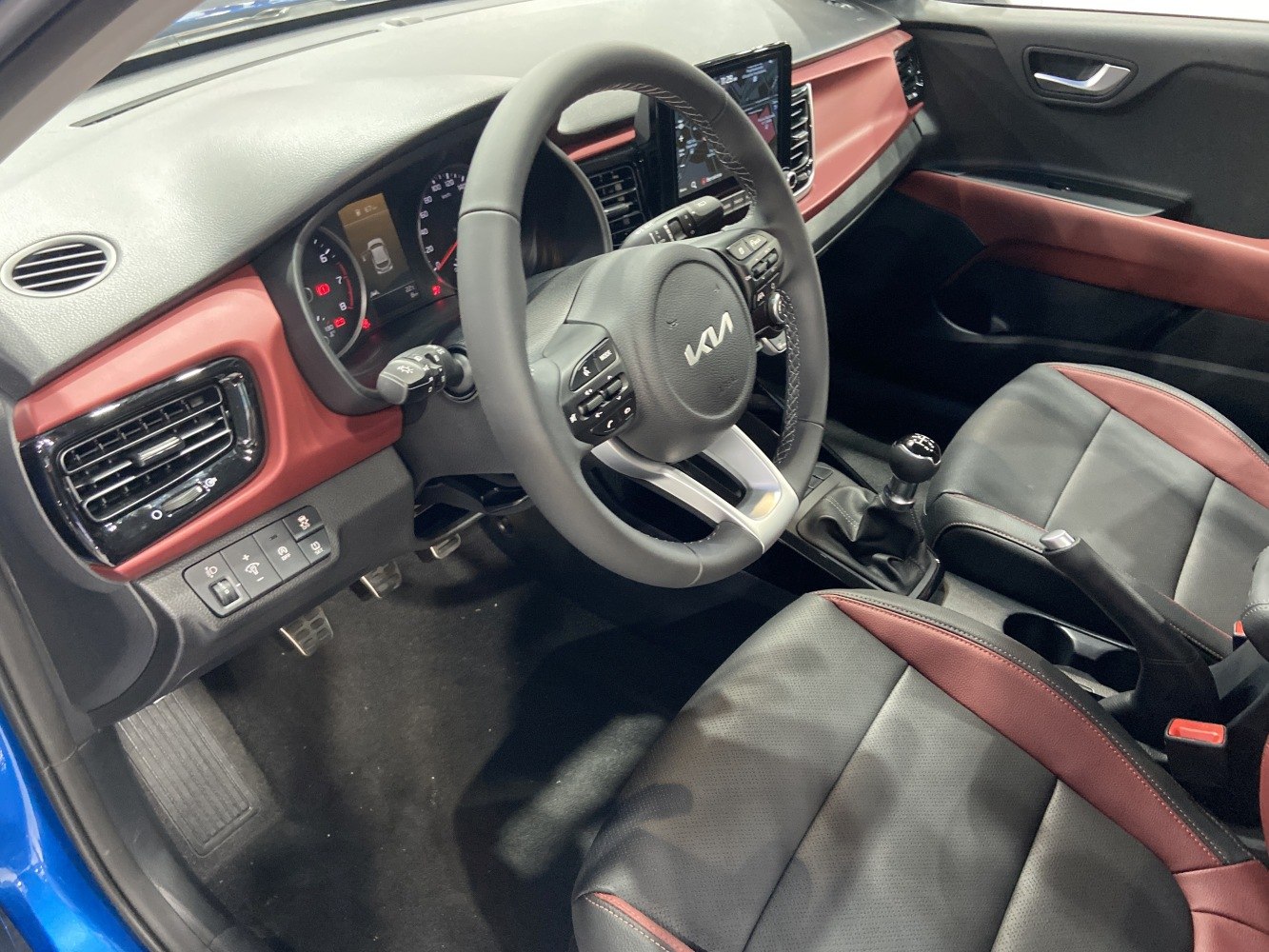 Steering wheel, dashboard, manual gear shift, seats in modern car interior
