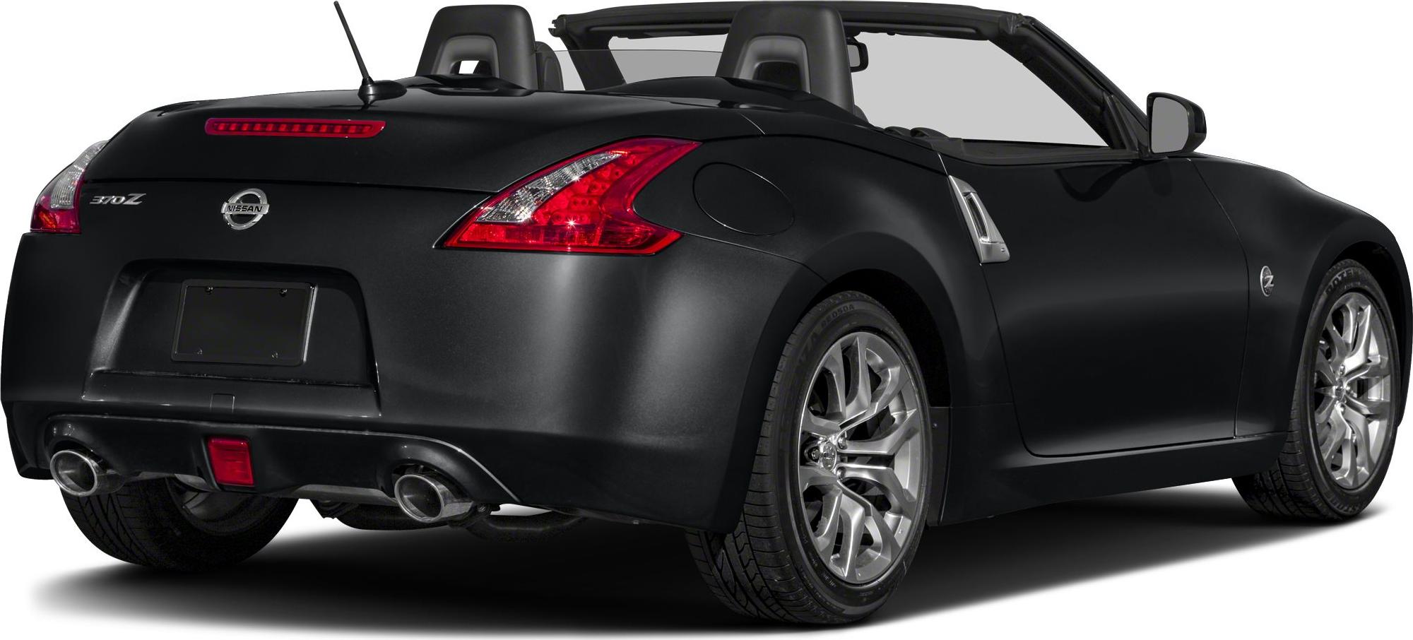 Rear and side view of a convertible with dual exhaust and open roof