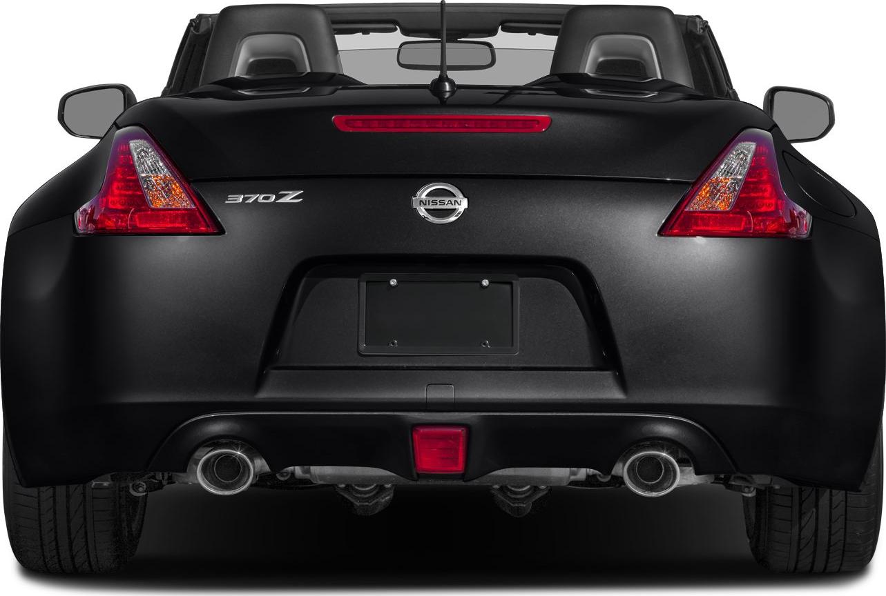 Rear view with dual exhausts, taillights, and convertible top.