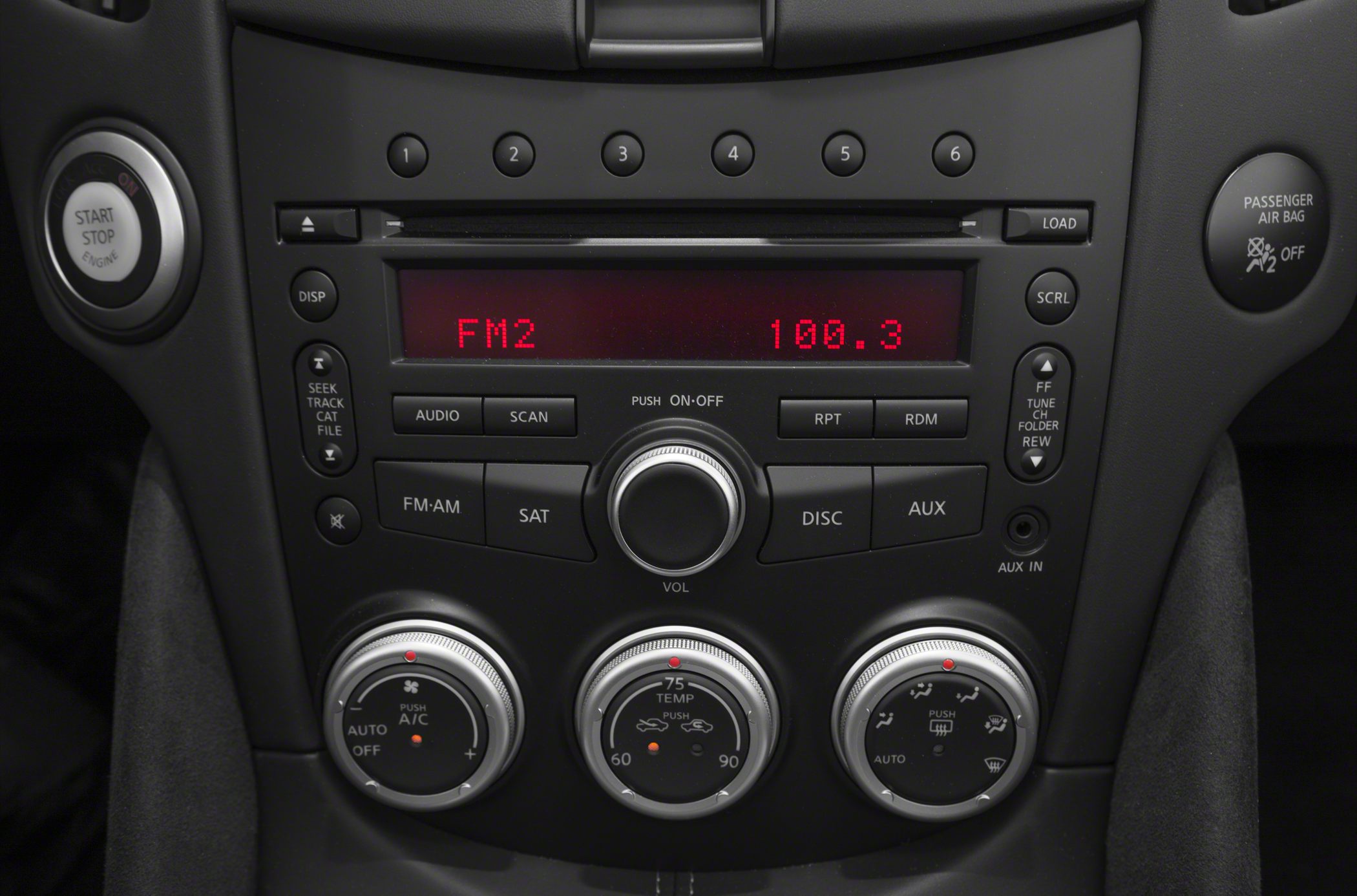 Car audio system and climate control knobs with start/stop engine button