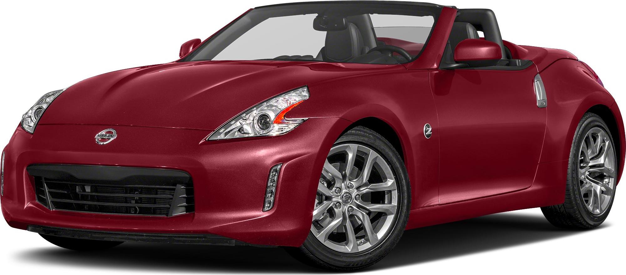 Front-side view of a red convertible with headlight and alloy wheel focus