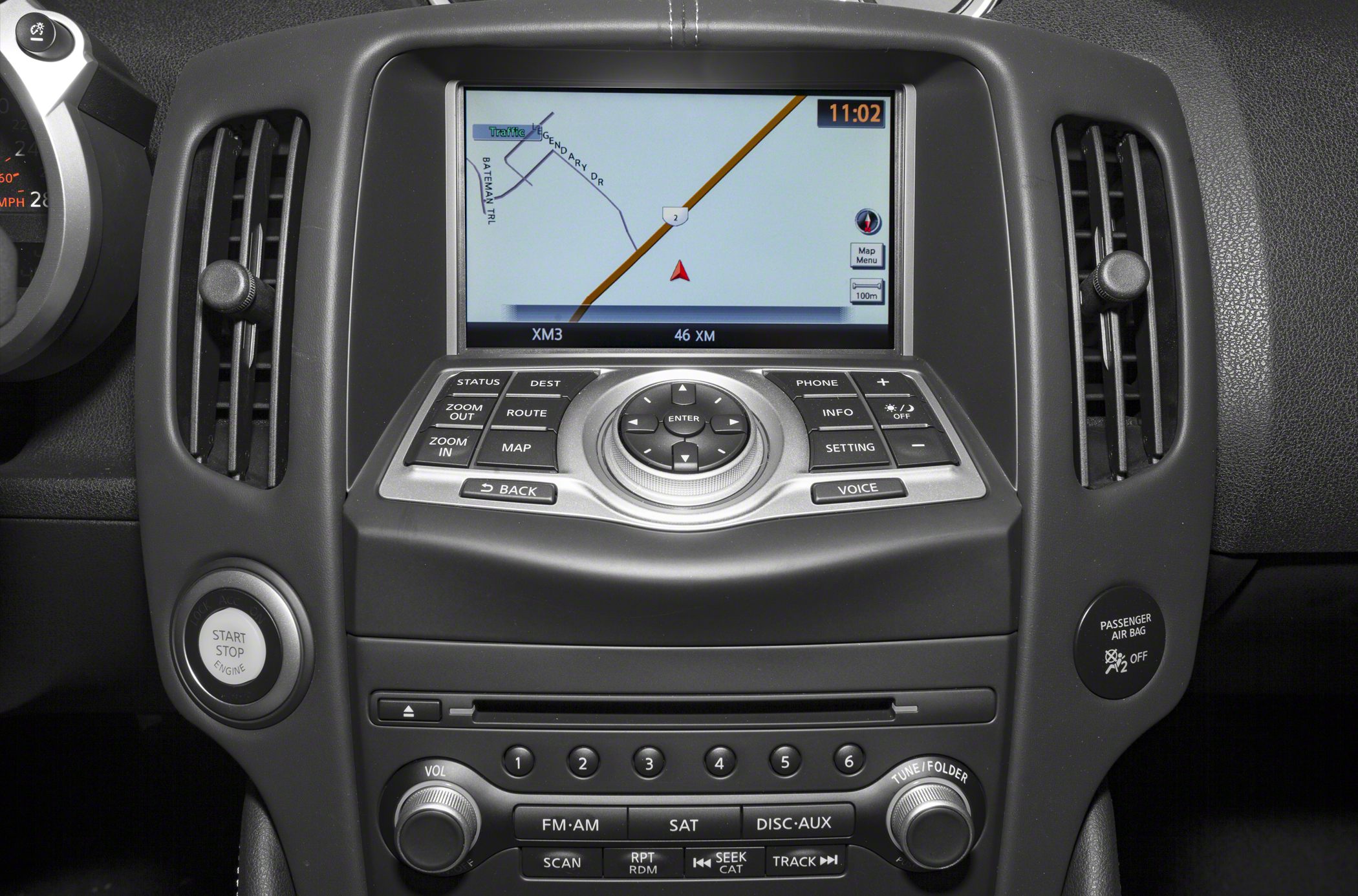 Navigation system screen with multimedia control buttons and air vents.
