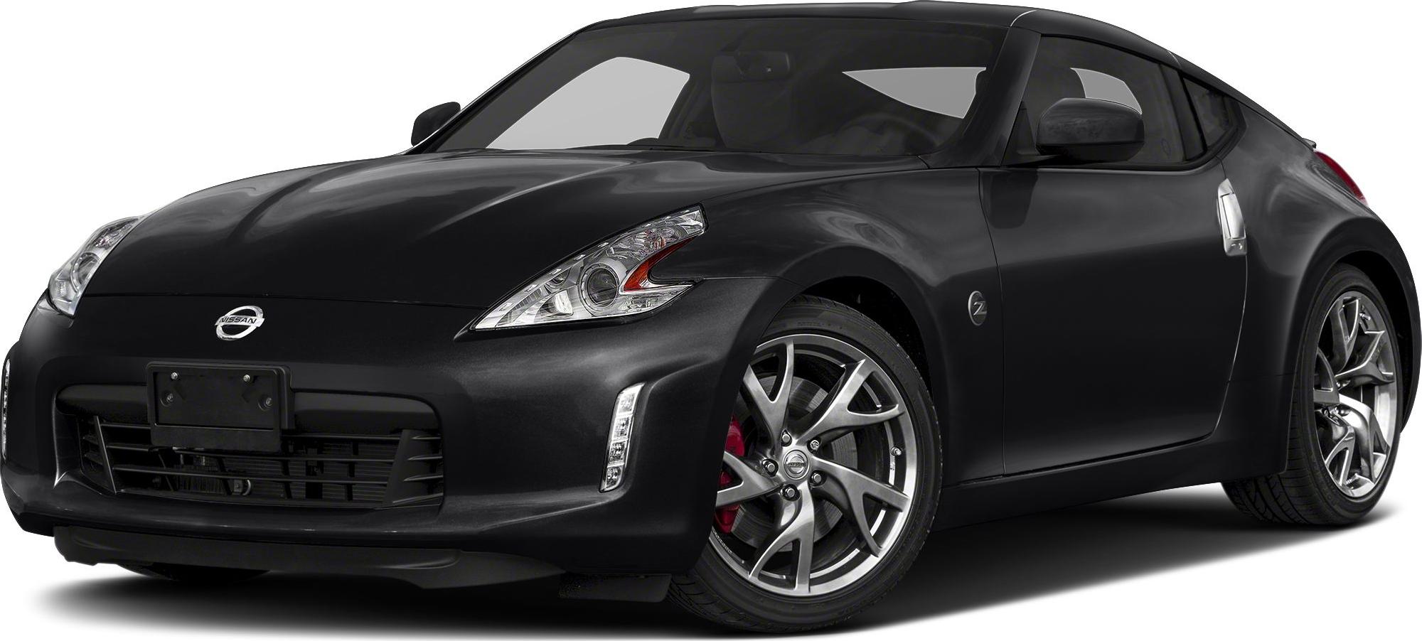 Black sports coupe front with distinct headlights and alloy wheels
