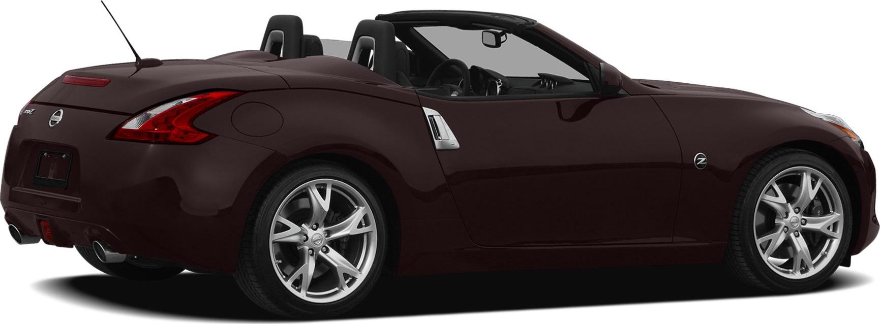 Rear-side view of a convertible sports car with alloy wheels and open top