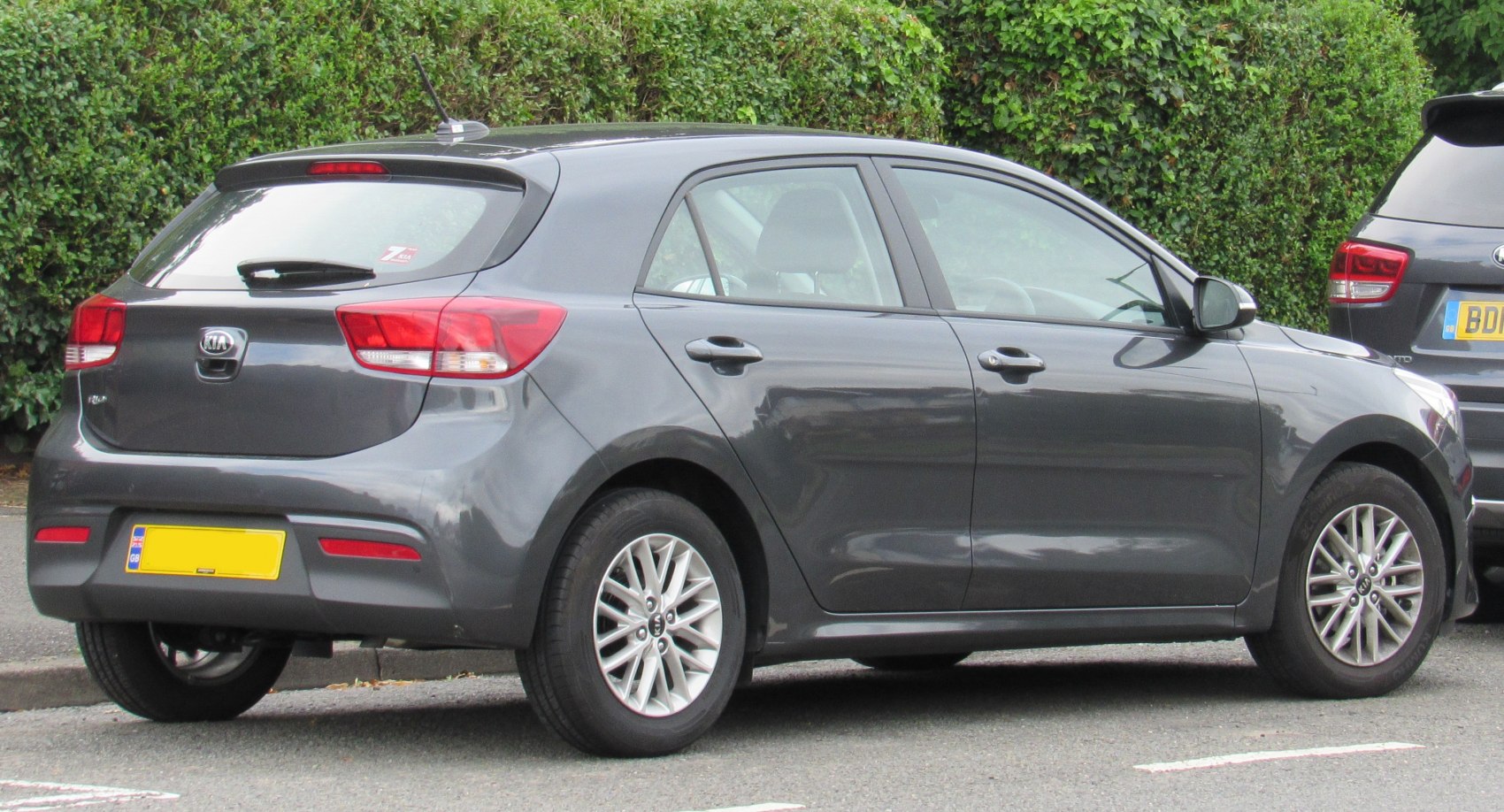 Rear-side view of grey hatchback with alloy wheels and modern rear lights