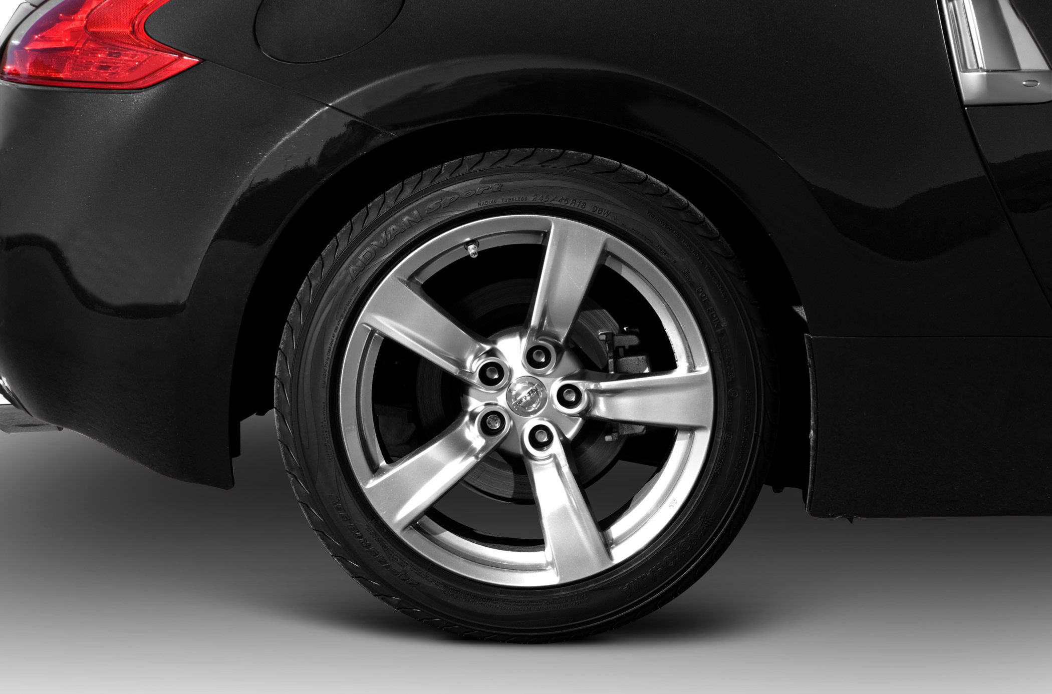 Close-up of rear alloy wheel and brake disc