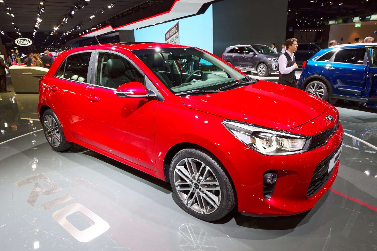 Red hatchback with sporty alloy wheels and modern headlights