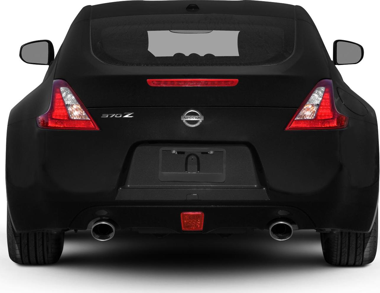 Rear view with dual exhausts and distinctive triangular tail lights