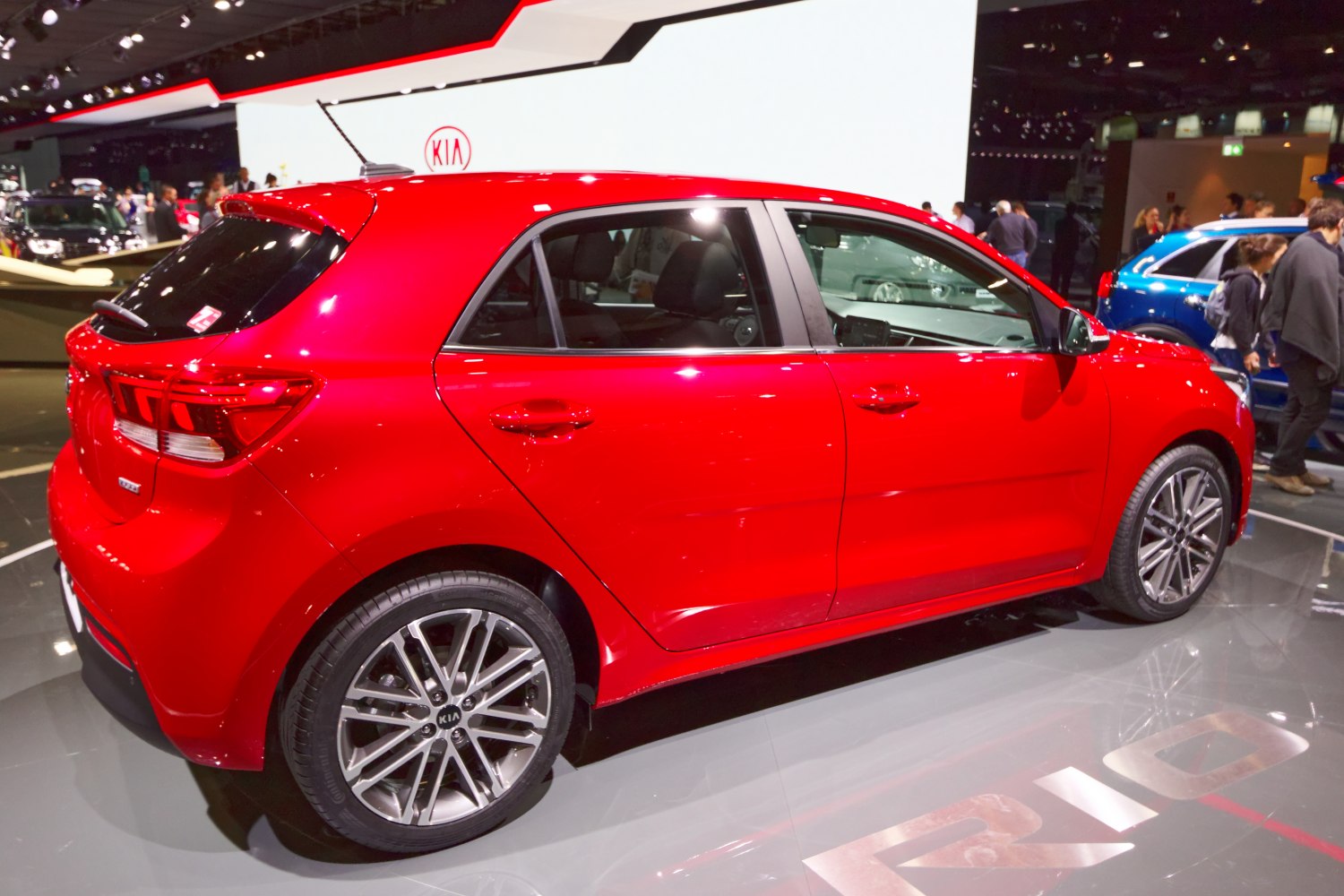 Side profile of red hatchback with alloy wheels