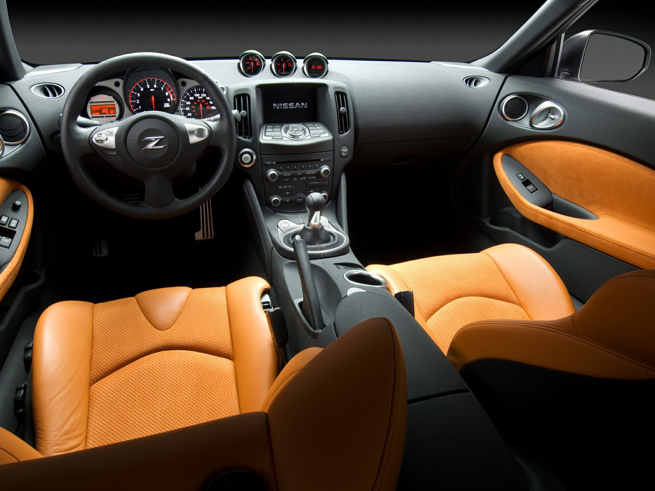 Sporty interior with manual gearbox and orange leather upholstery