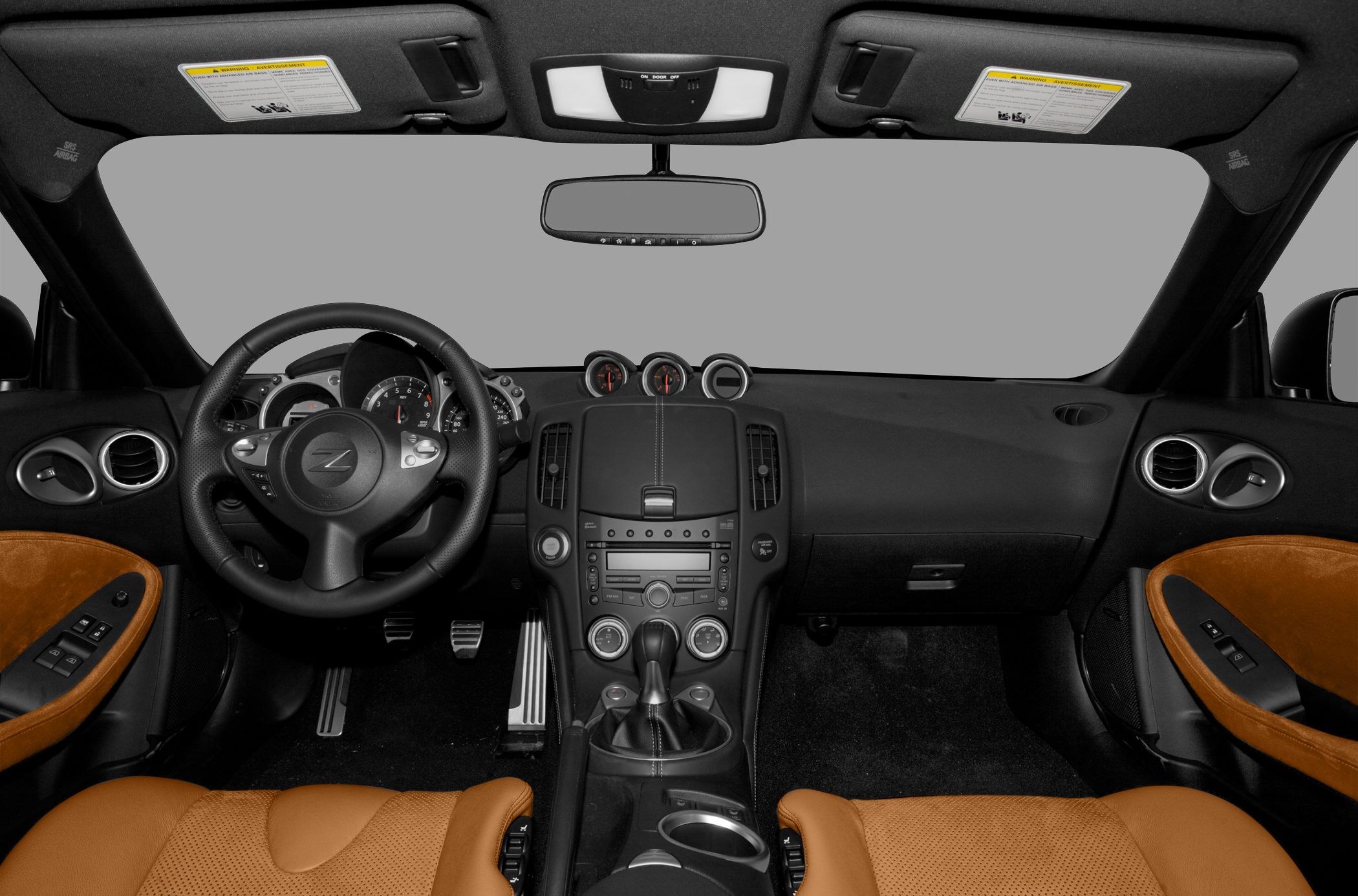 Sports car interior with leather seats and three central gauges