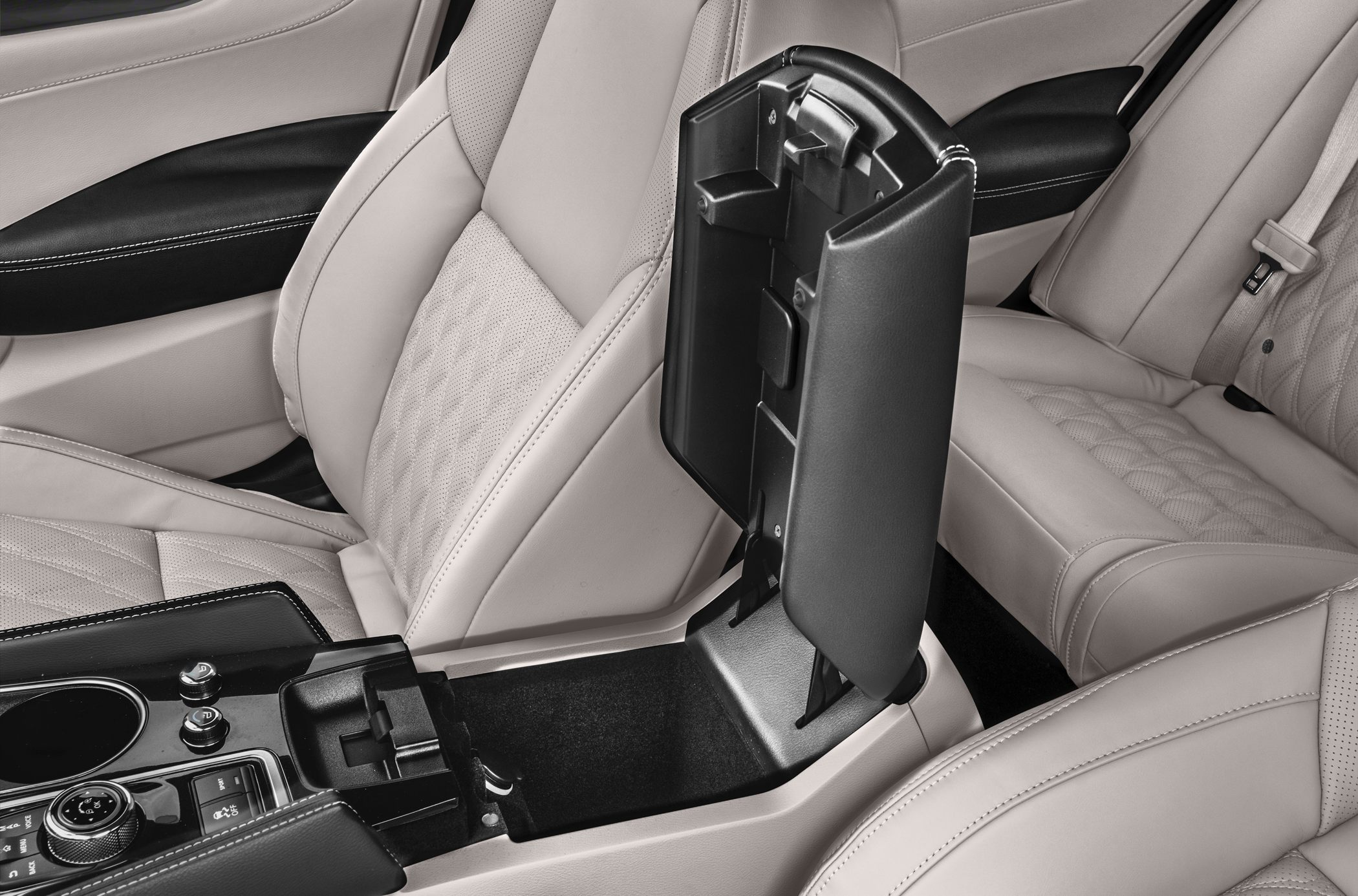 Beige leather seats with open center console storage and armrest