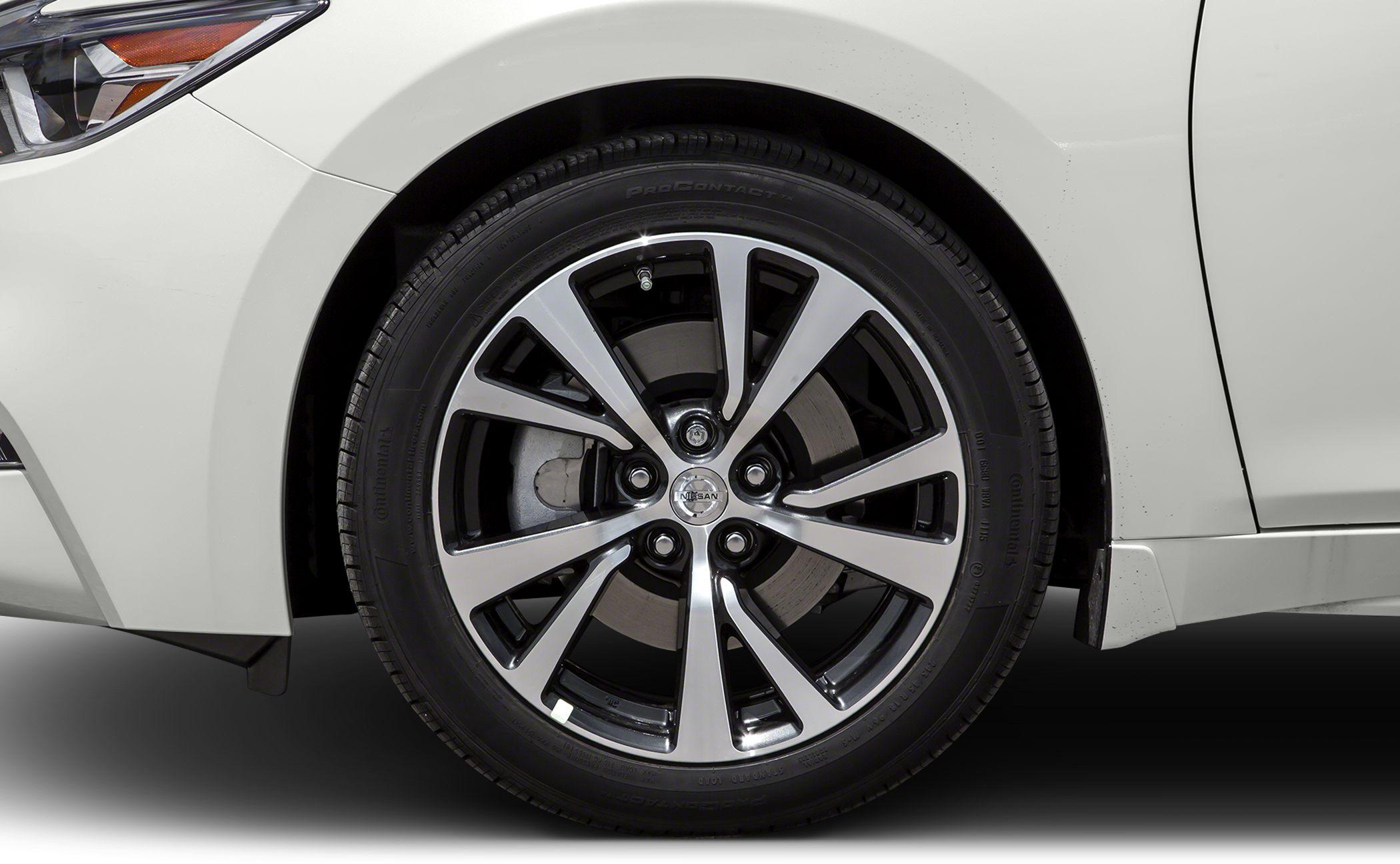 Close-up of alloy wheel with Continental tire and visible brake disc.