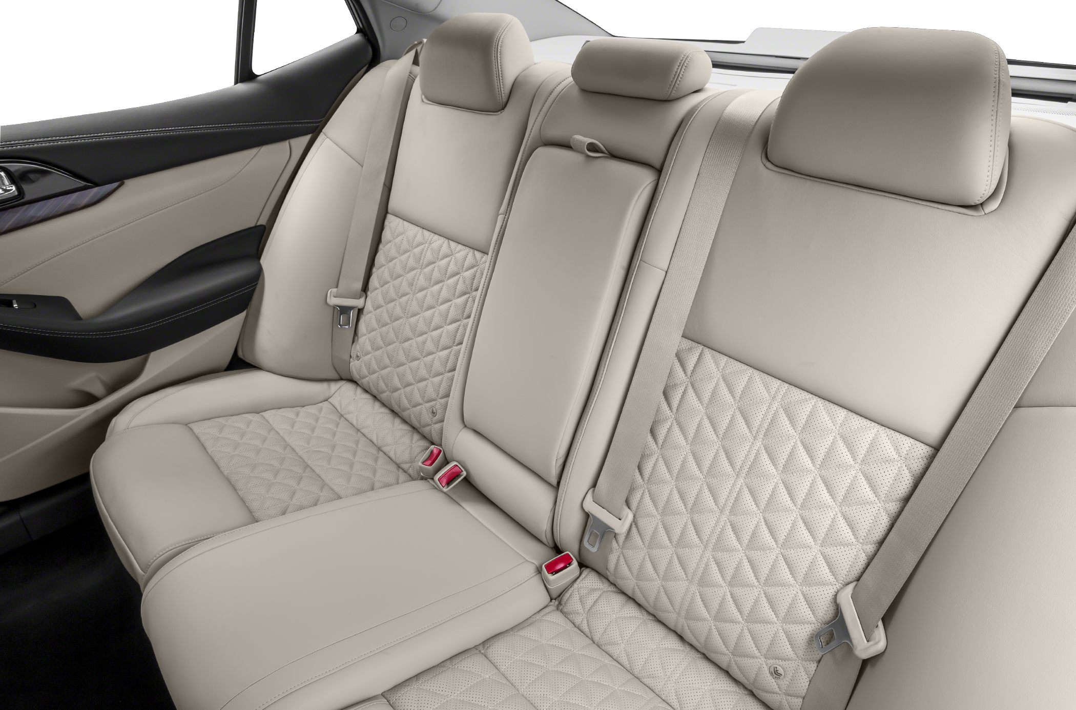 Beige rear seat with quilted leather and integrated seat belts.