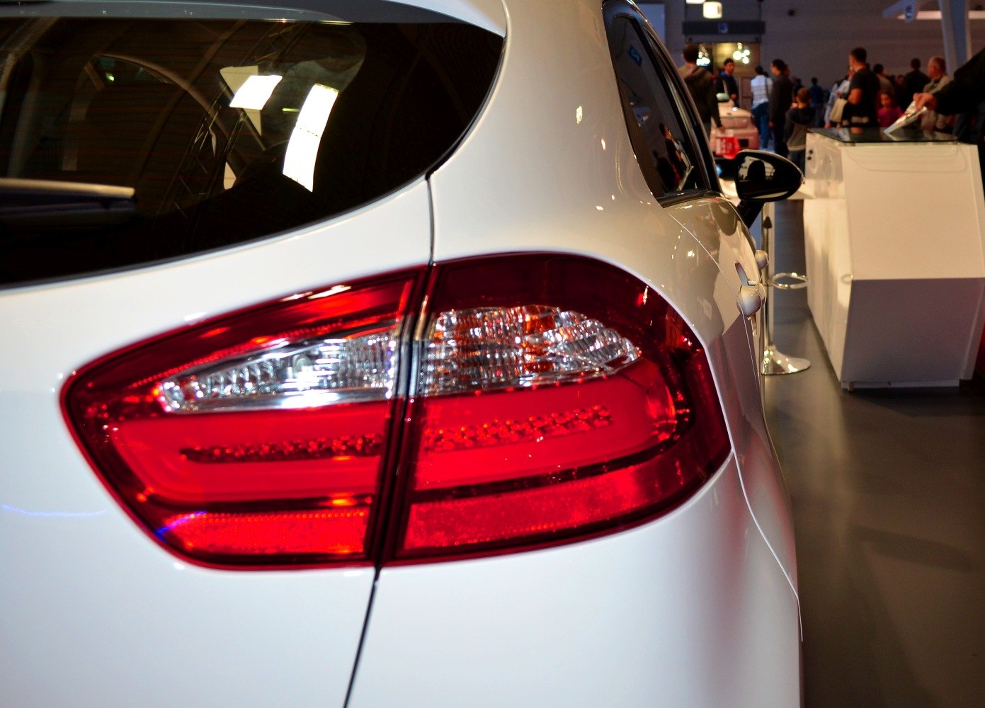 Close-up of rear light cluster and rear body panel of a white hatchback