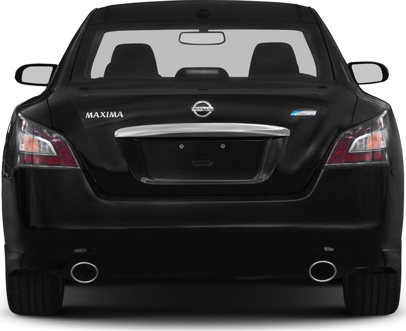 Dual exhaust pipes and rear taillights of a sedan