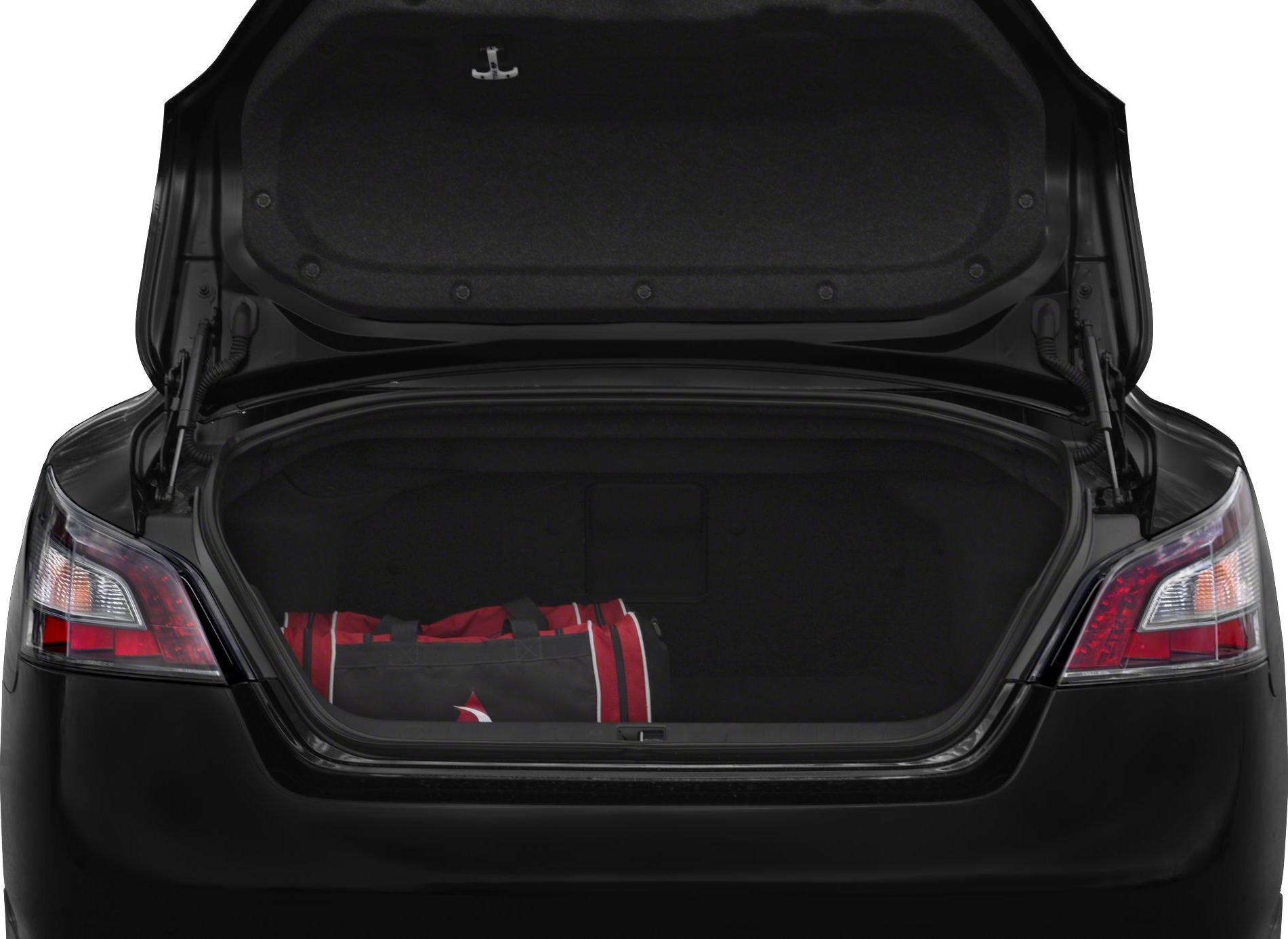 Open sedan trunk with sports bag inside