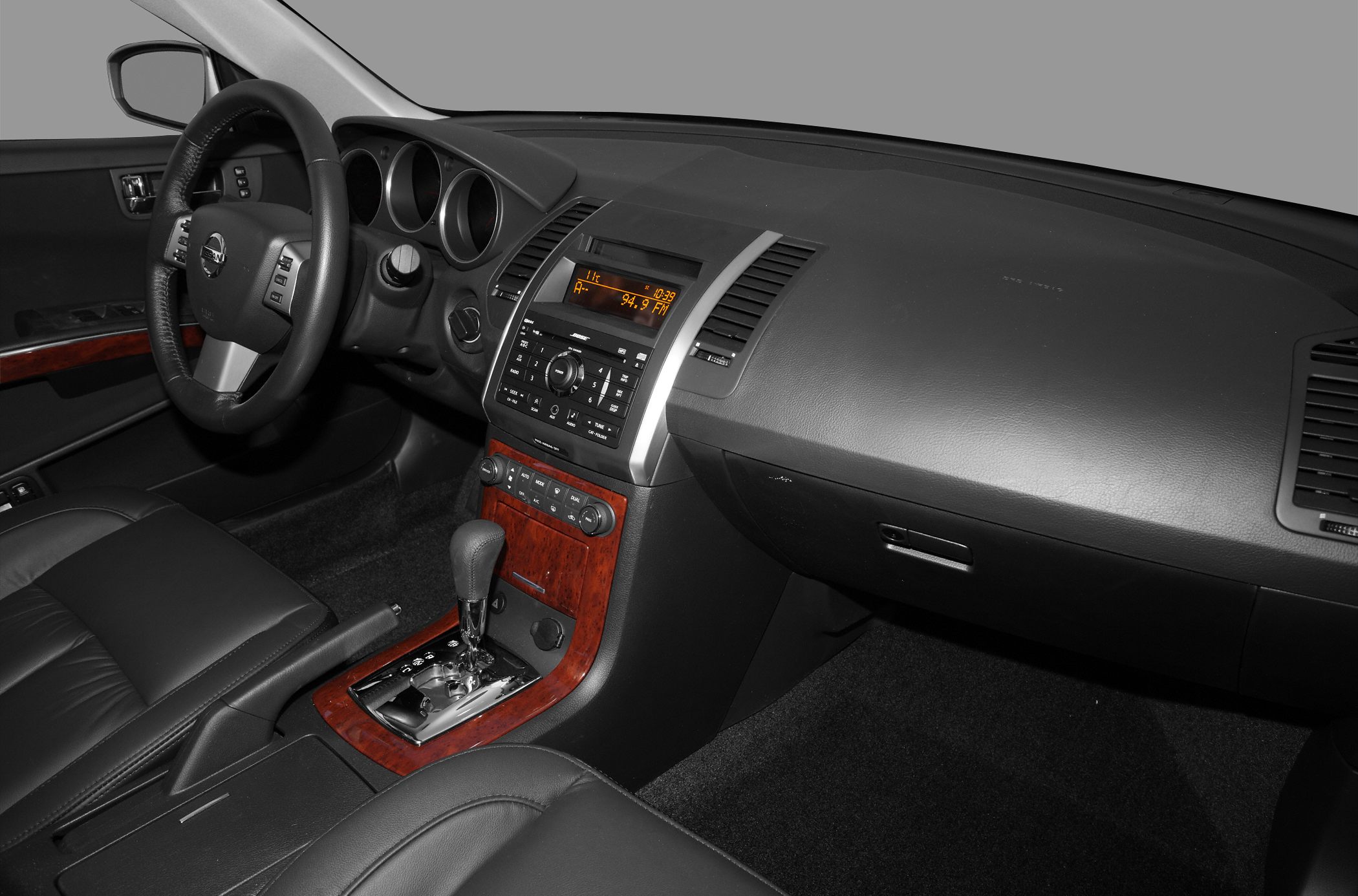 Dashboard and center console with wood trim and gear shifter