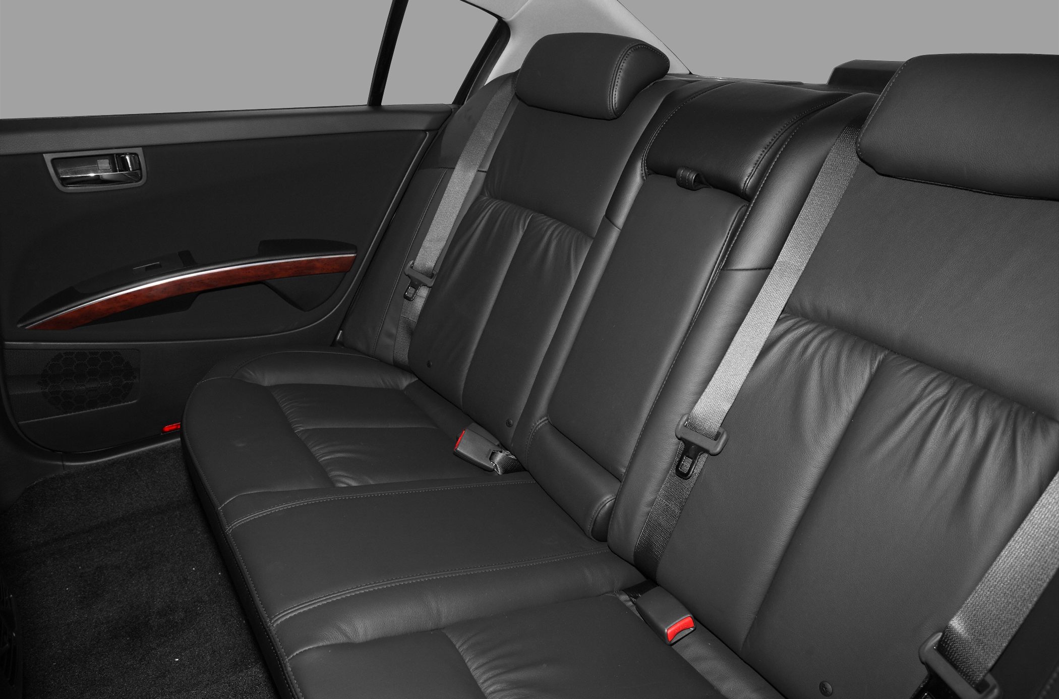 Rear leather seat with seatbelts and door panel wood trim