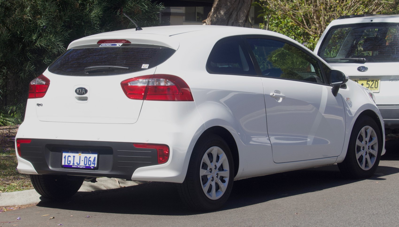 Rear and side view of compact 3-door hatchback with distinct tail lamps