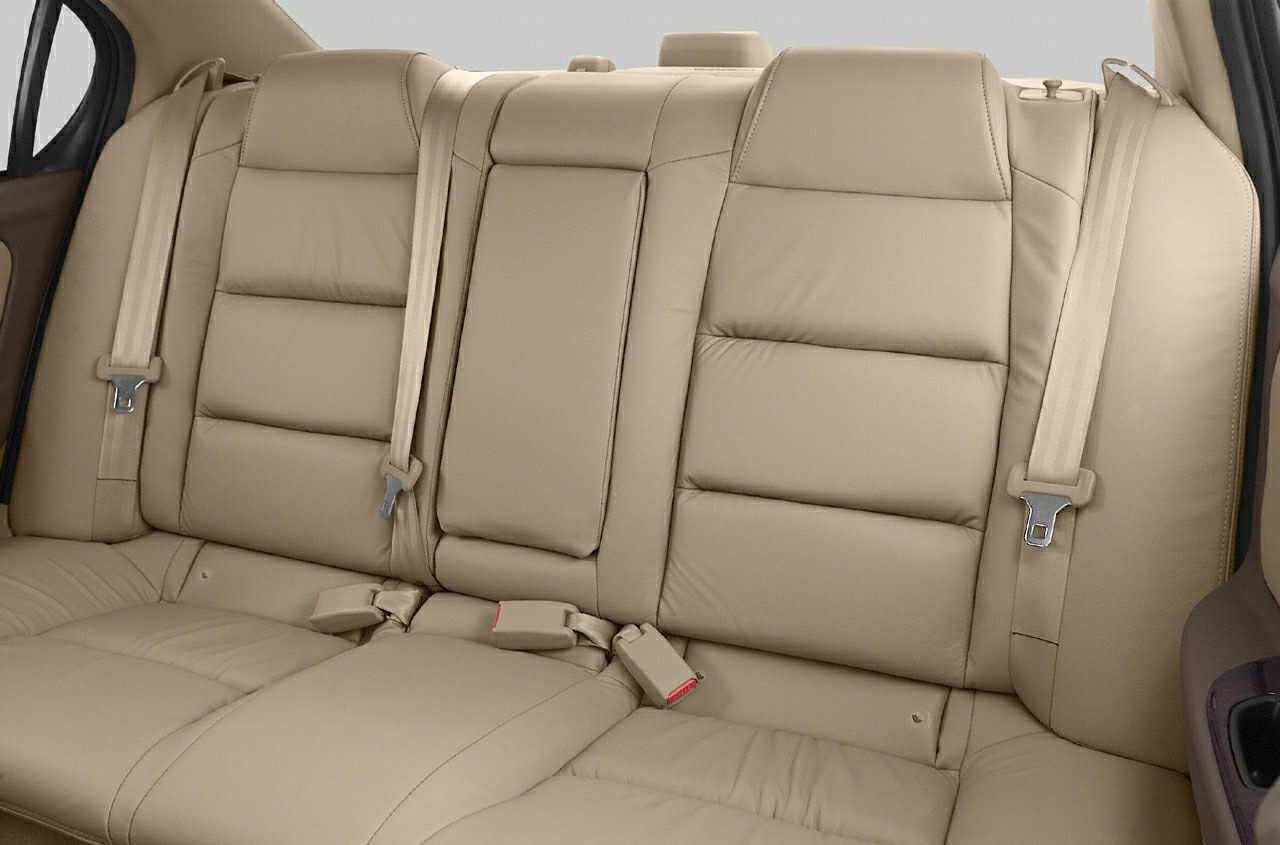Beige leather rear seats with seat belts and central armrest