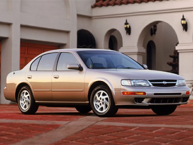 Front three-quarter view of four-door sedan with alloy wheels and integrated headlamps.