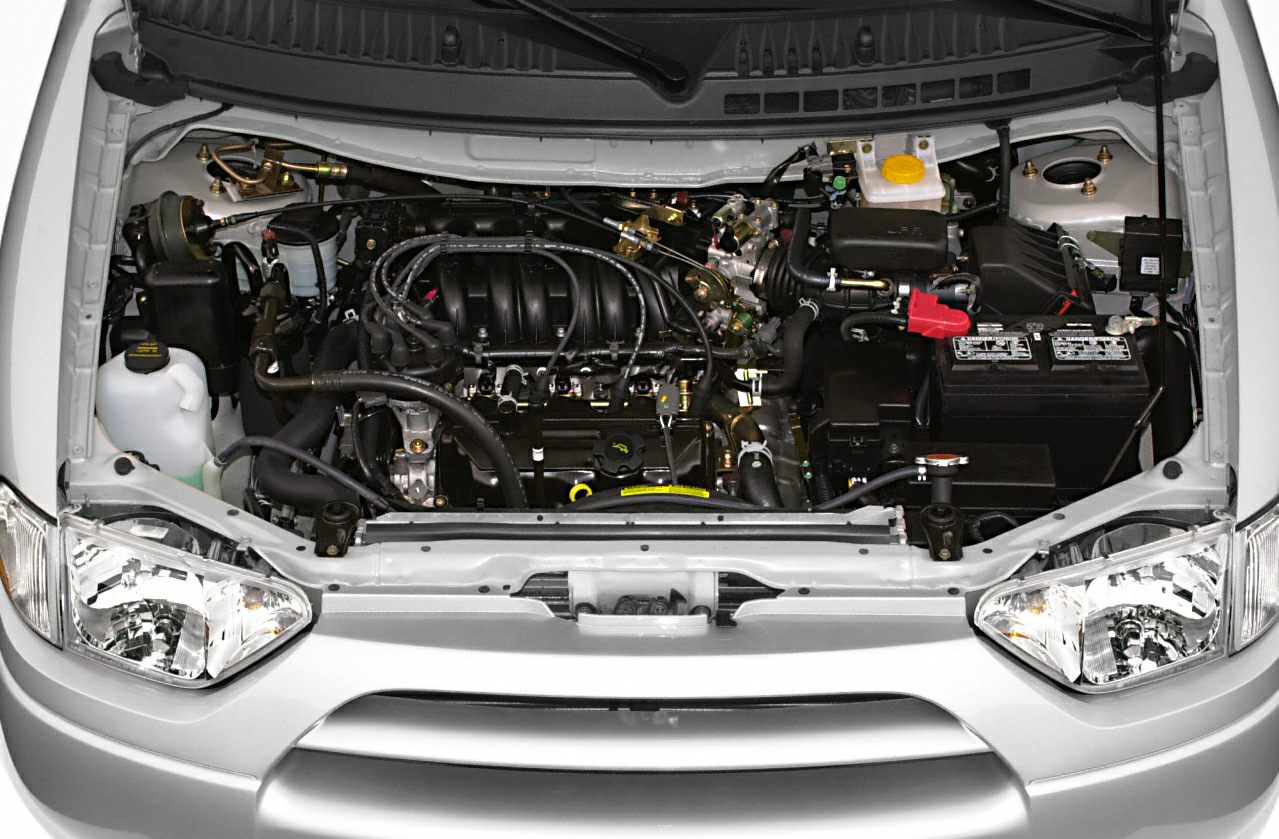 Engine bay with exposed components and front headlights