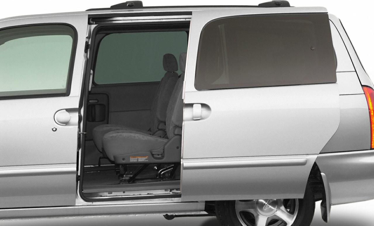 Sliding door with two visible interior seats in a minivan