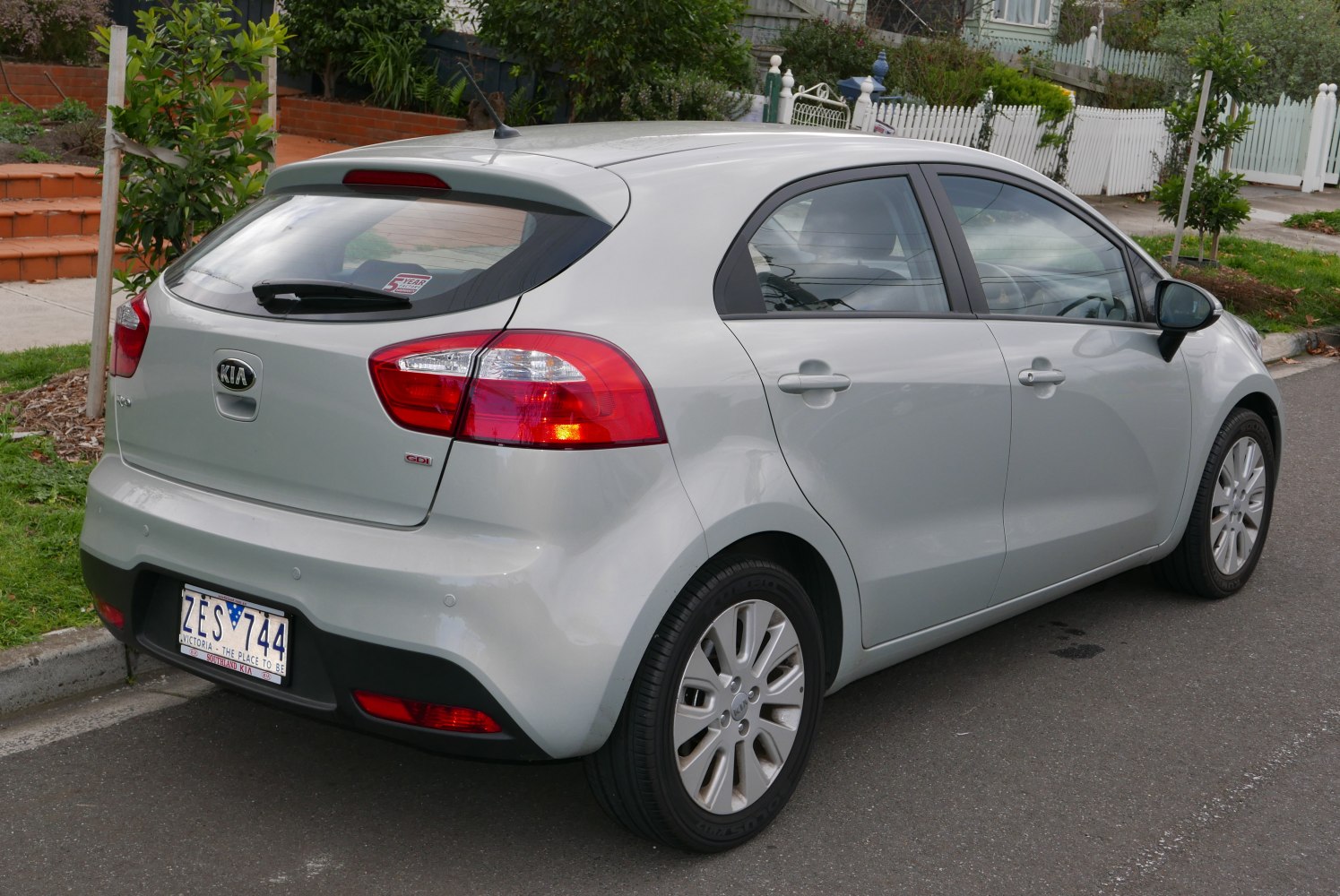 Rear three-quarter hatchback with distinct taillights and alloy wheels