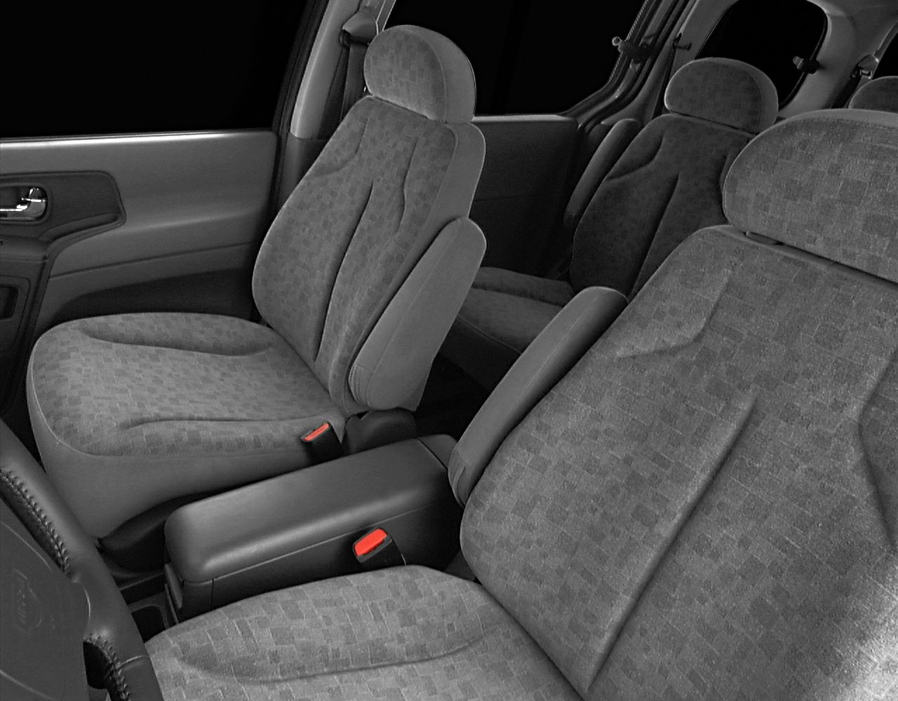 Fabric seats with armrest in spacious vehicle interior