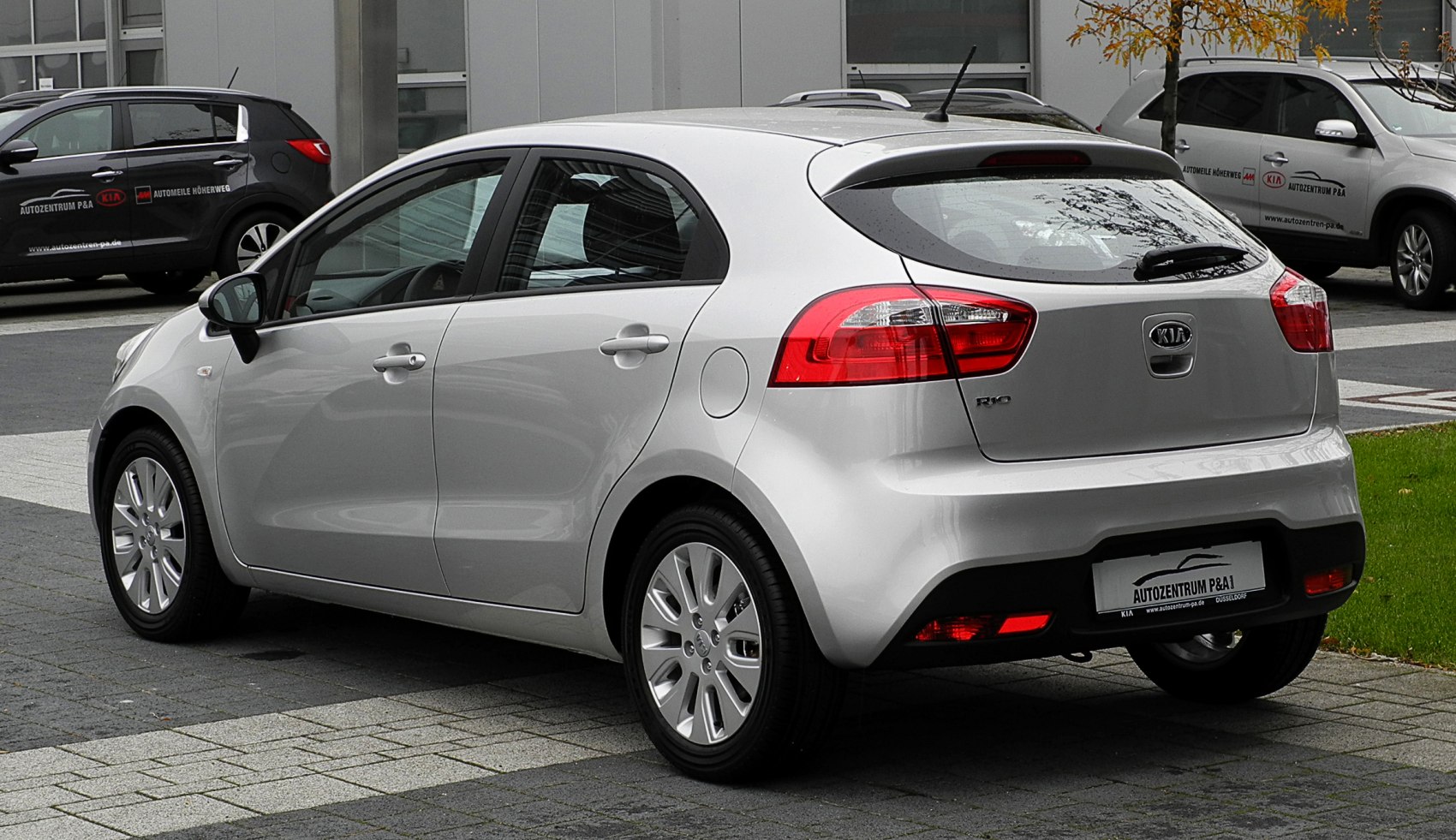 Rear hatchback view with tail lights and alloy wheels