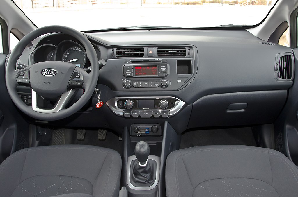 Car interior dashboard, steering wheel, and gear stick