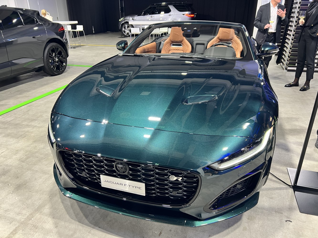 Front view with honeycomb grille and LED headlights of a Jaguar convertible