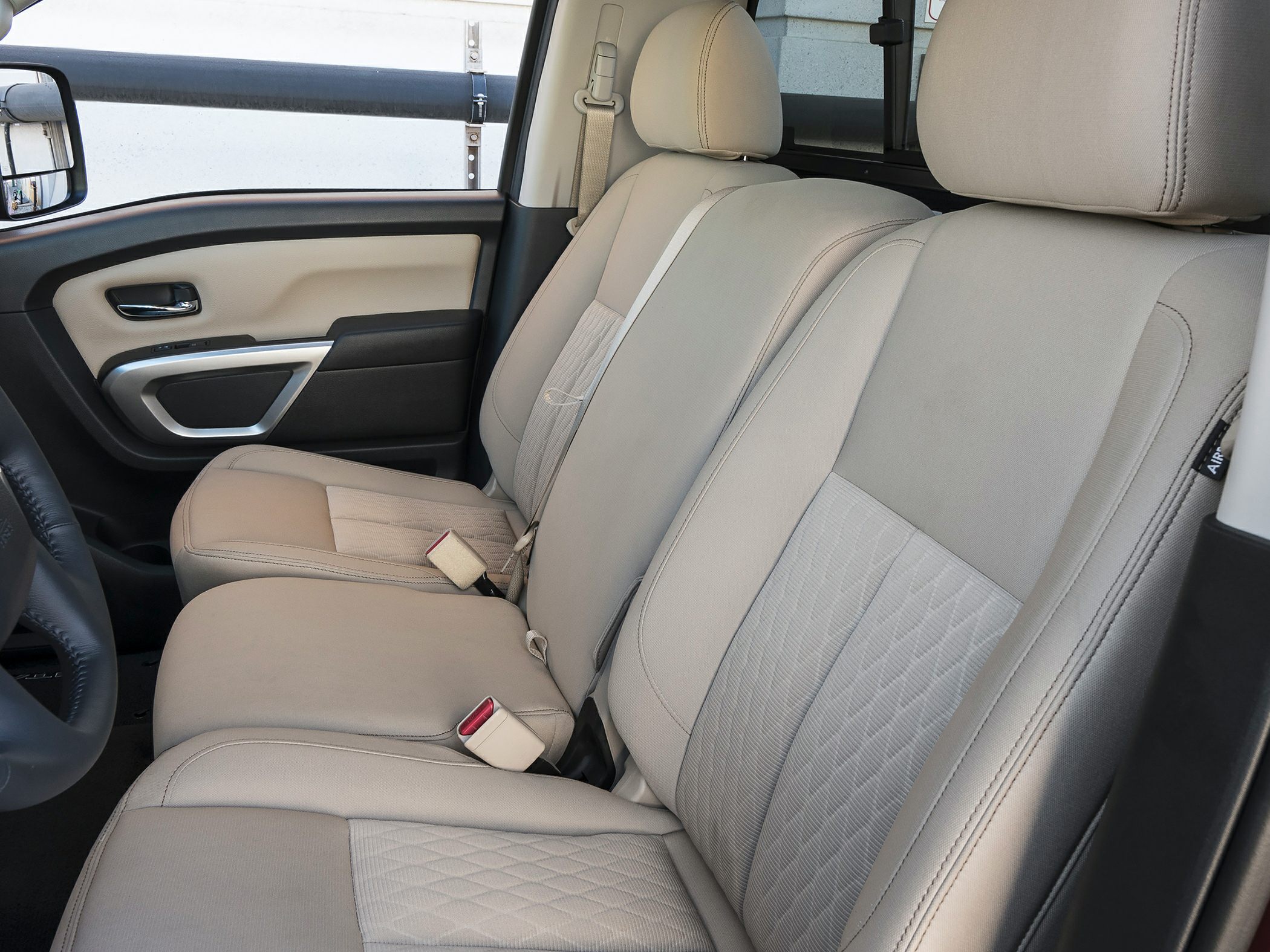 Beige fabric front seats and door panel details