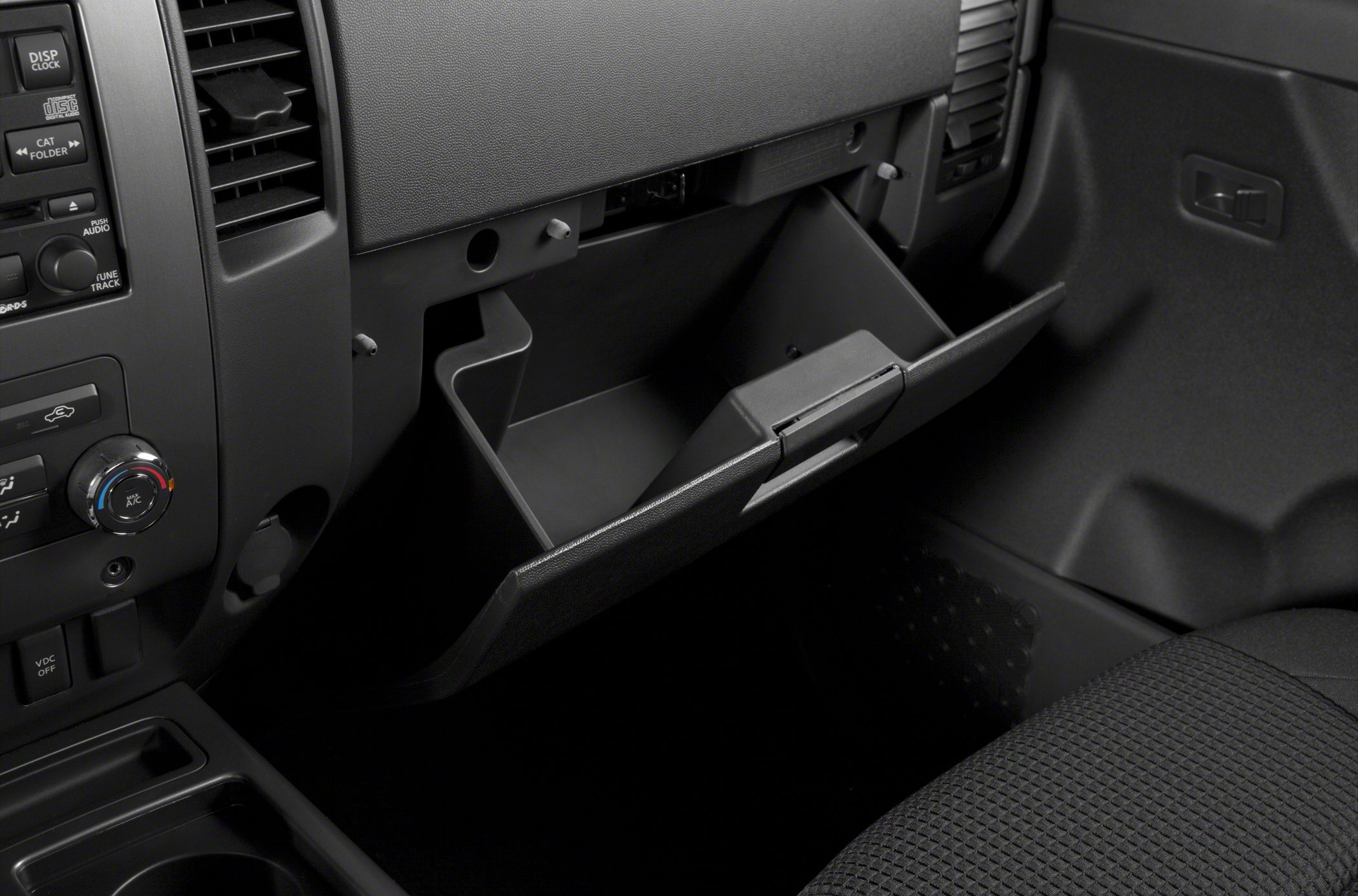 Open glove compartment and dashboard controls with air vent