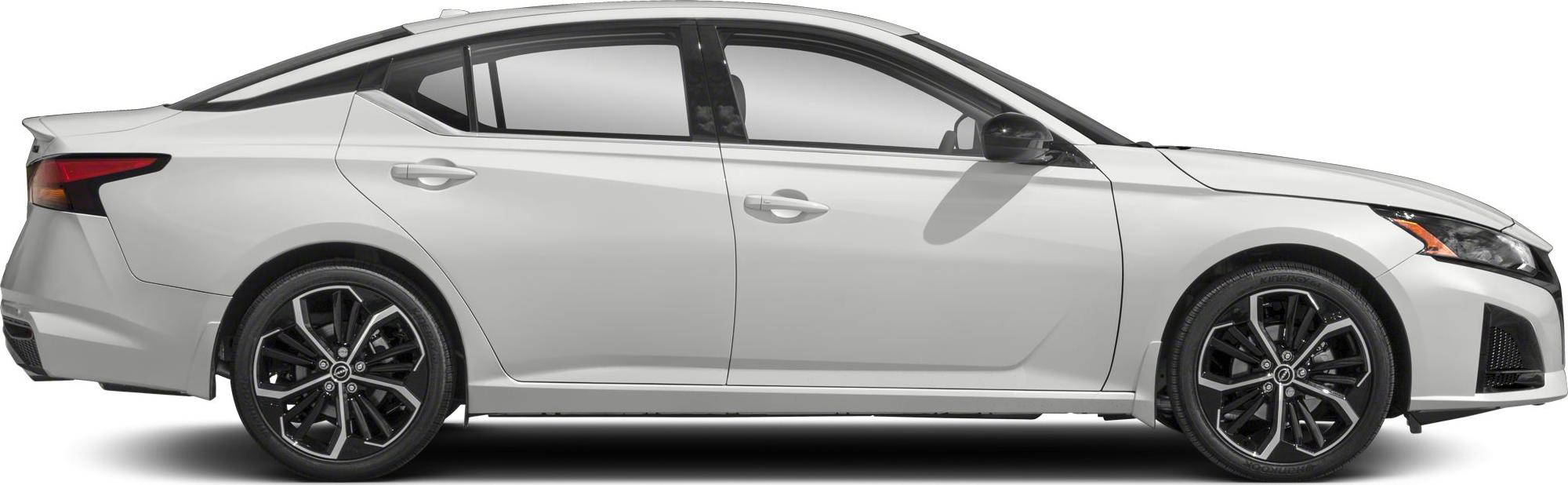 Side profile of sedan with black multi-spoke alloy wheels and sharp body lines