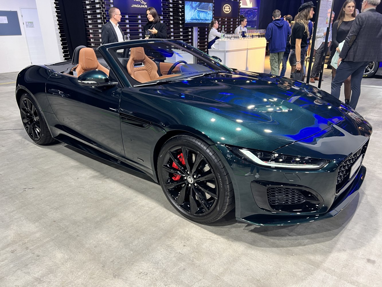 Convertible sports car with tan leather seats and black alloy wheels