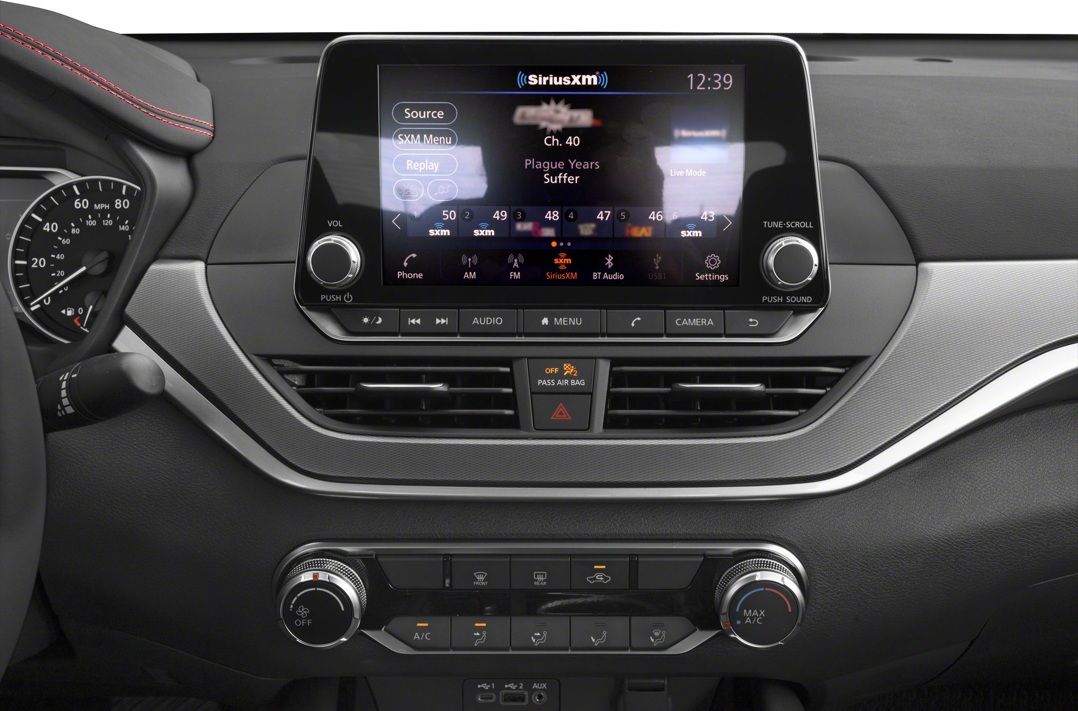 Infotainment touchscreen and climate control panel in car interior