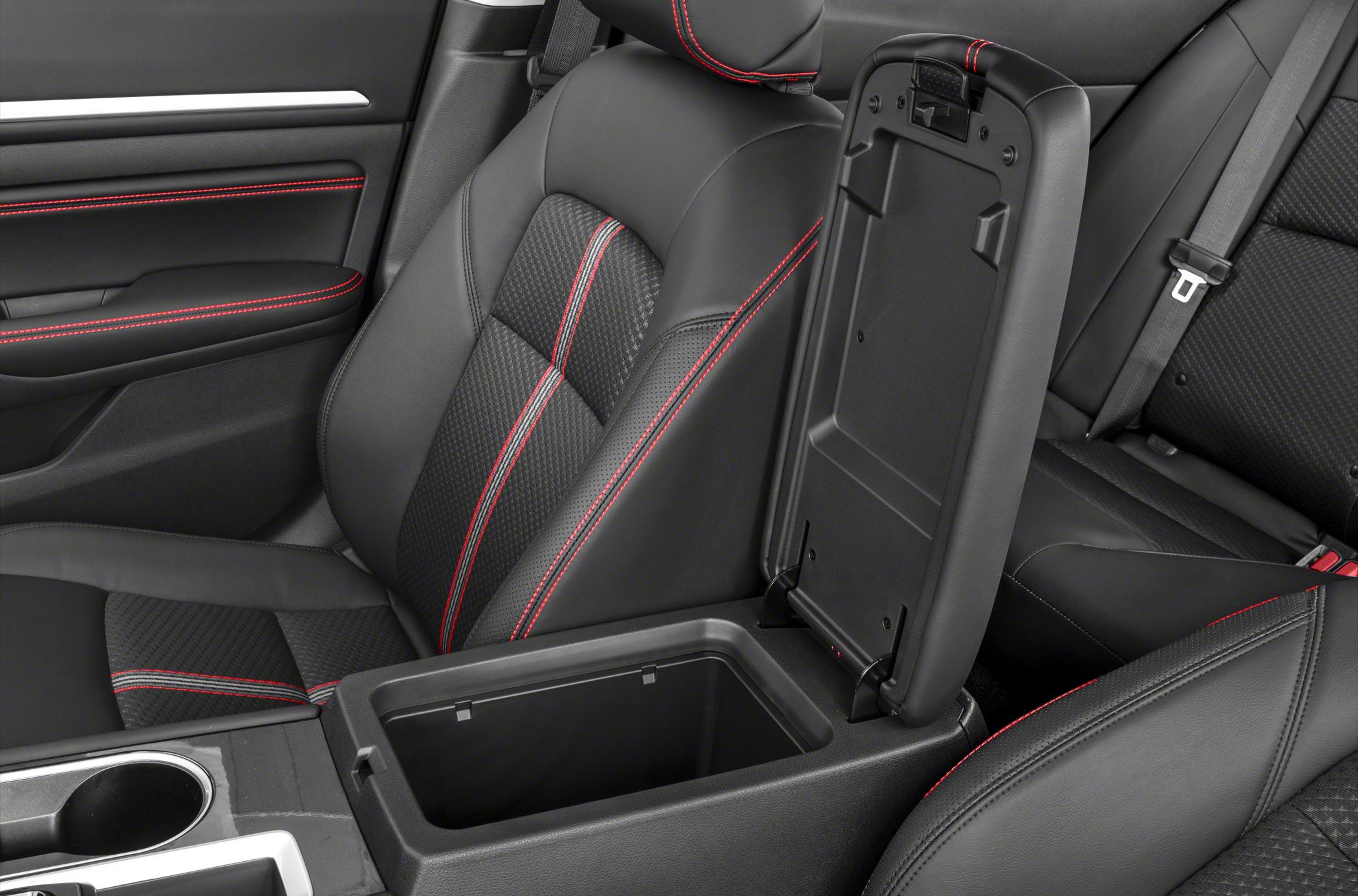 Sporty seats with red stitching and open center console storage