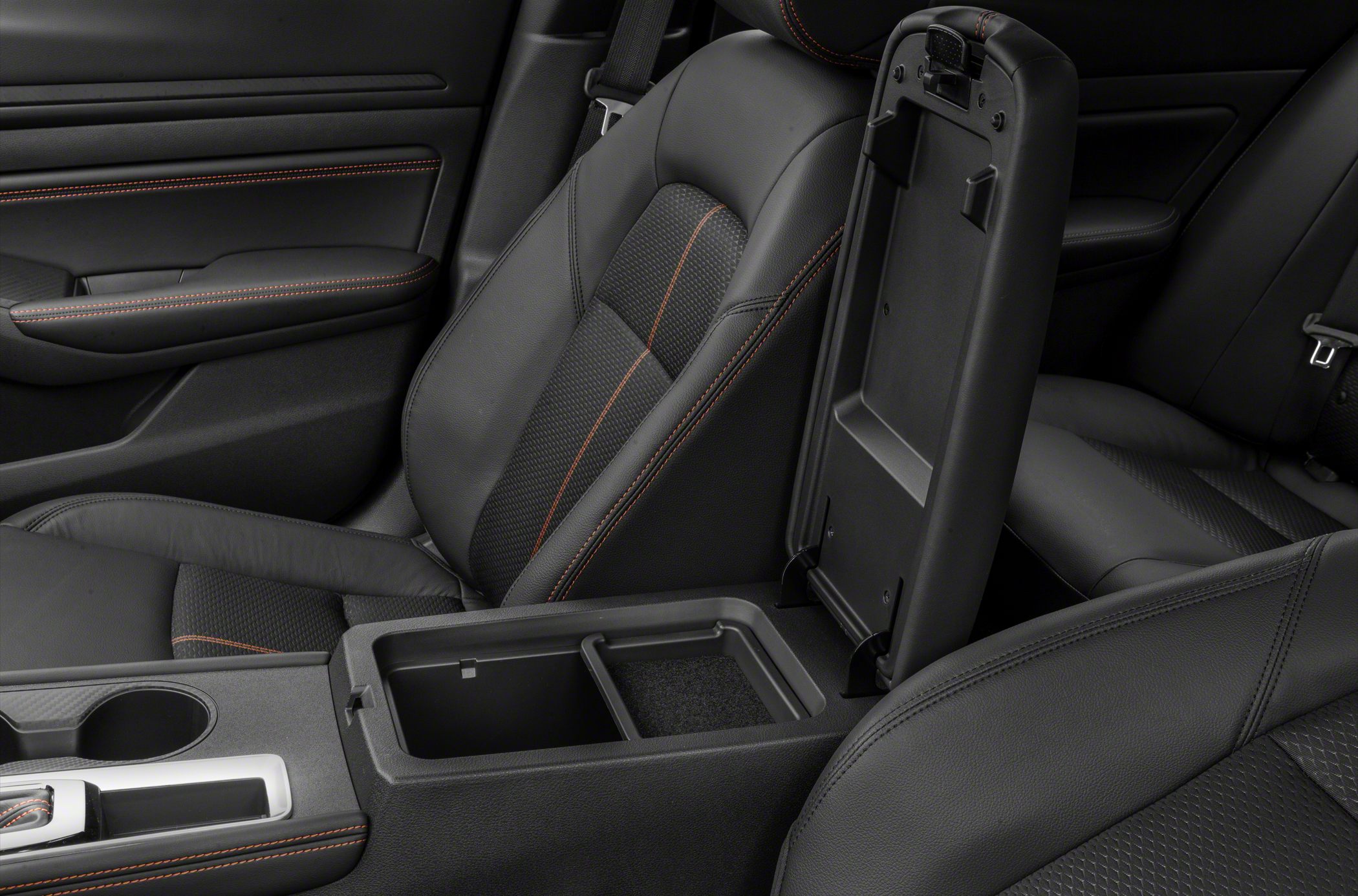 Open center console storage and leather car seats with red stitching