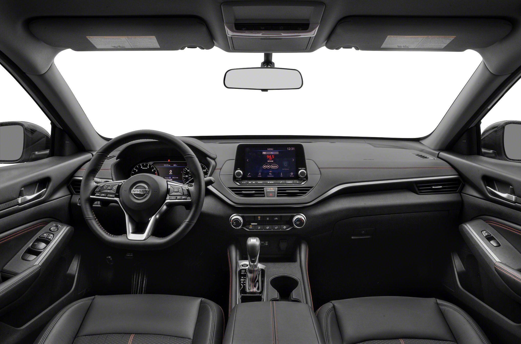 Modern car interior with dashboard, steering wheel, central display, and gear shift