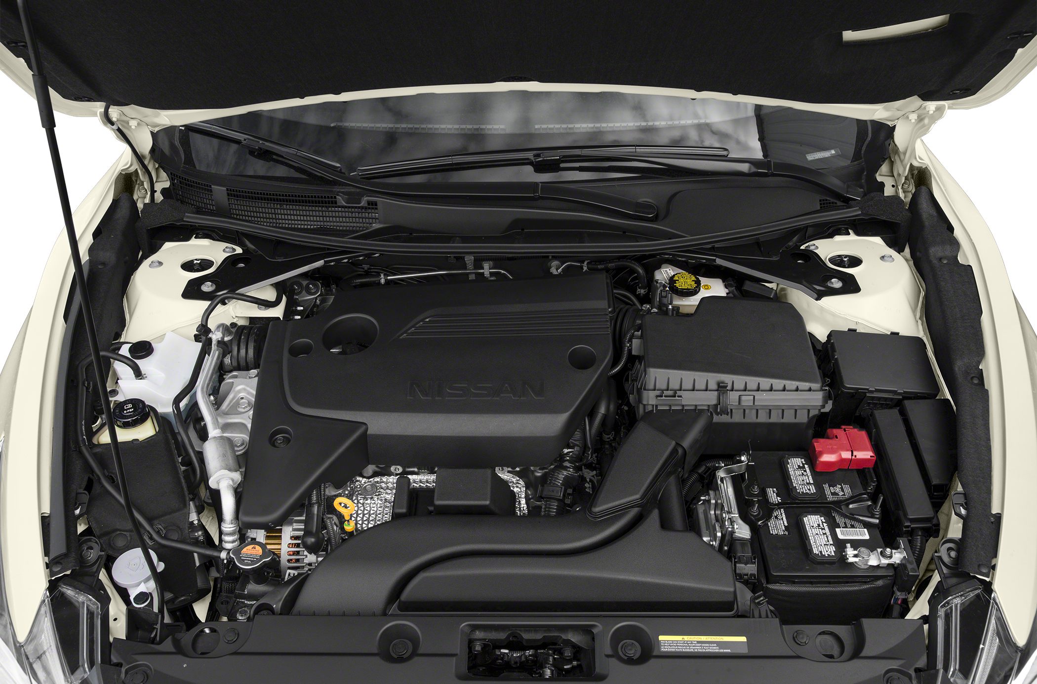 Engine bay with black plastic engine cover and visible battery compartment