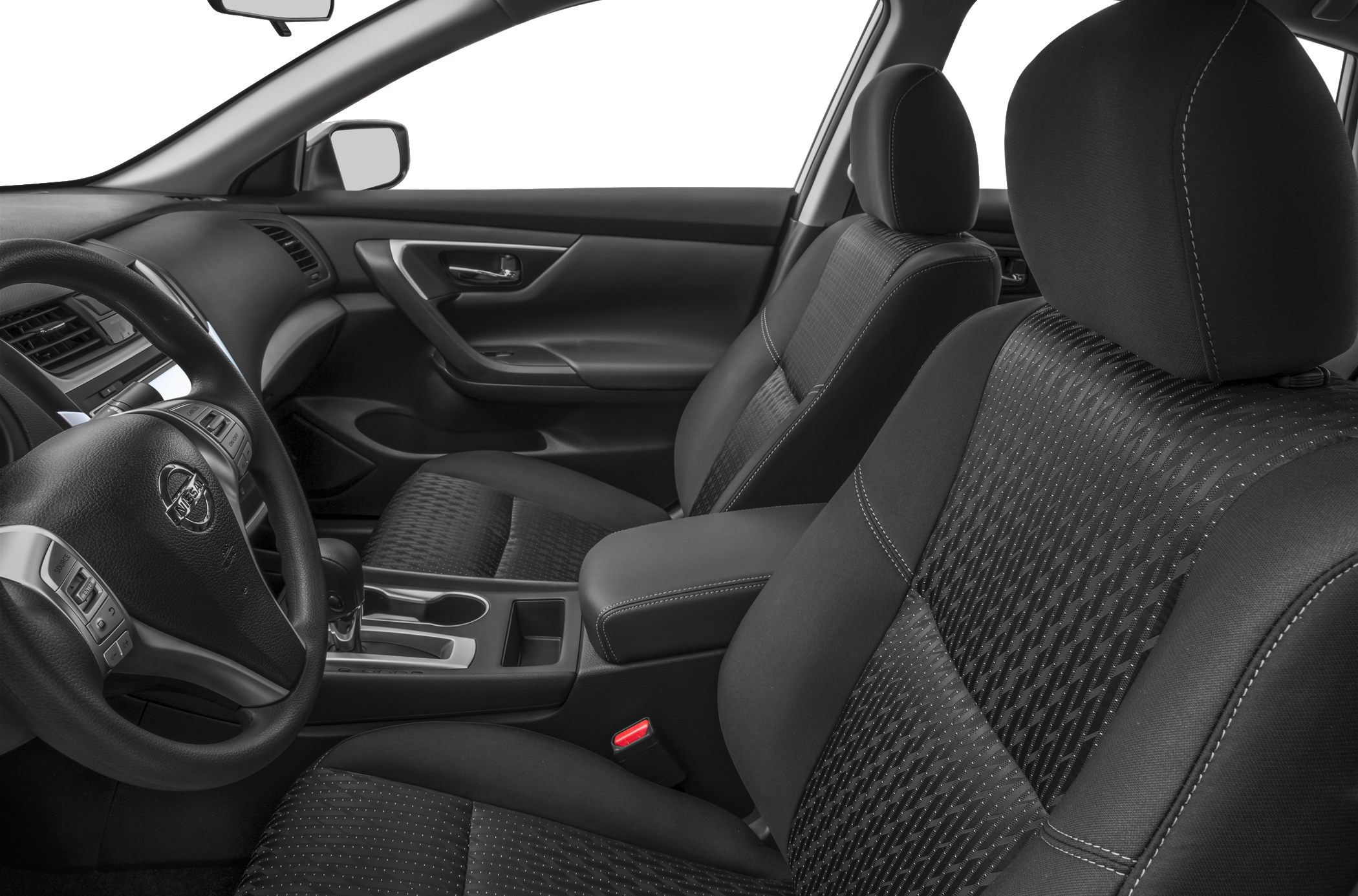 Front interior showing dashboard, steering wheel, and patterned seats