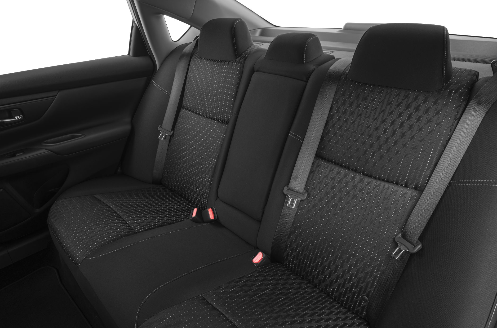 Rear seat interior with fabric upholstery, headrests, and seat belts