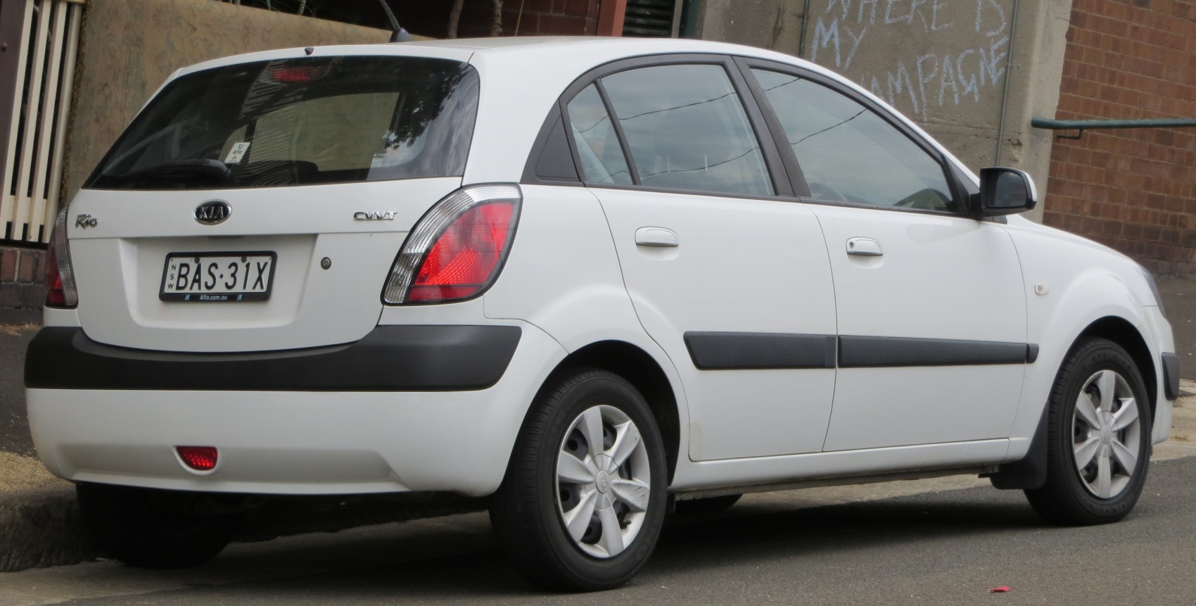 Rear-side view of compact hatchback with distinctive taillights and black bumper trim