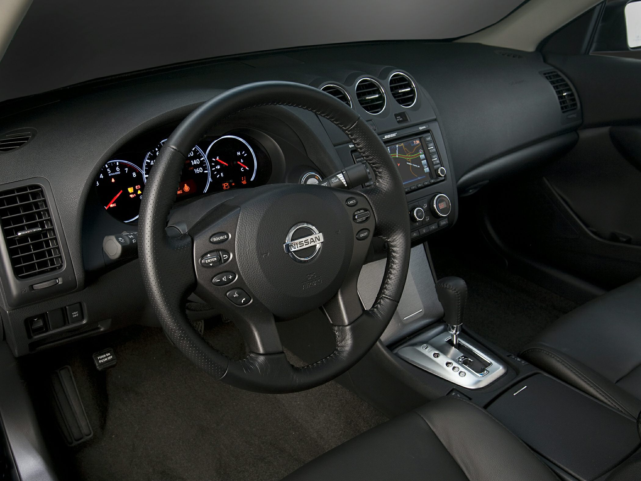 Multifunction steering wheel and dashboard with center console navigation