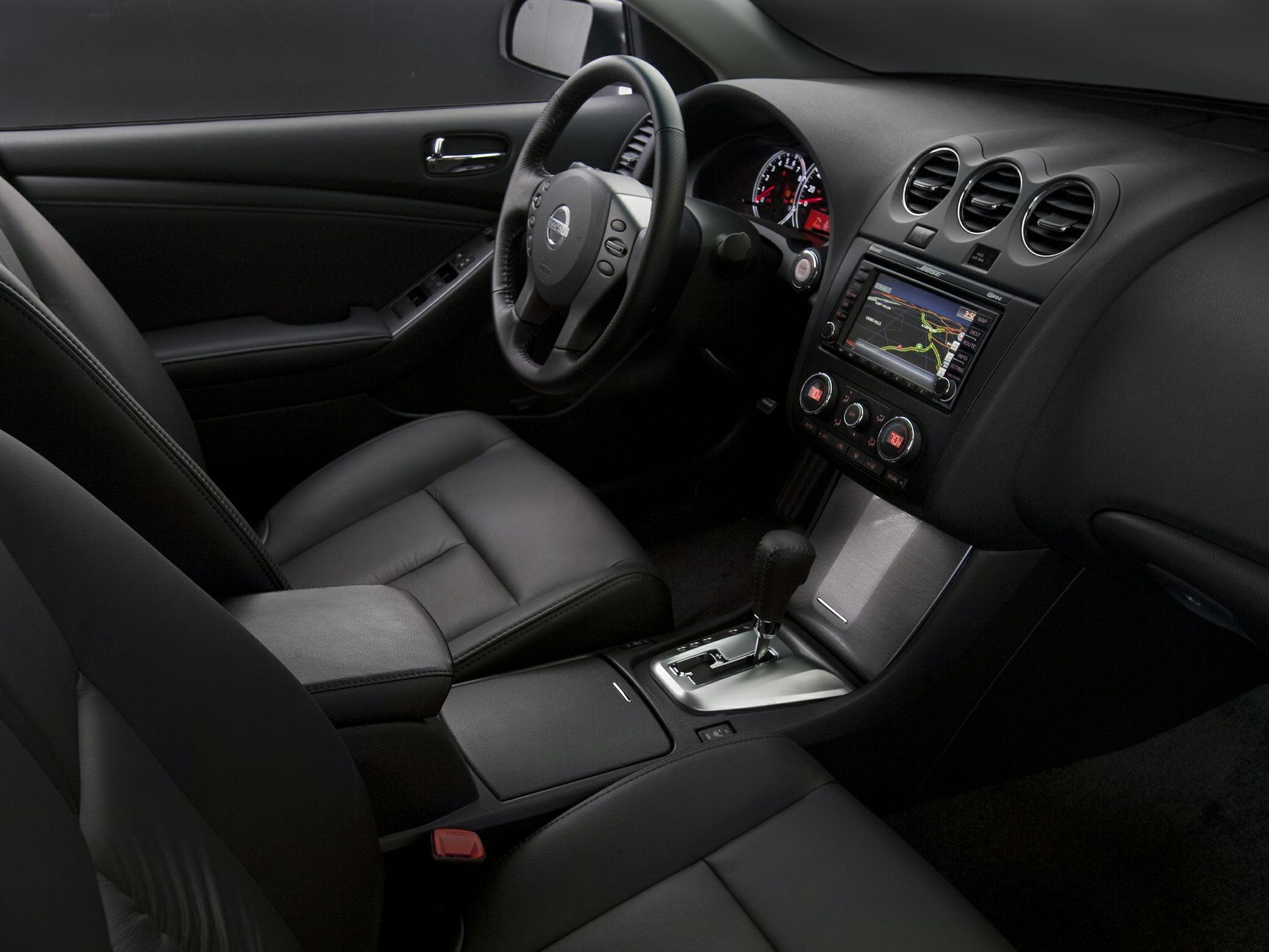 Dashboard with navigation system and black leather seats